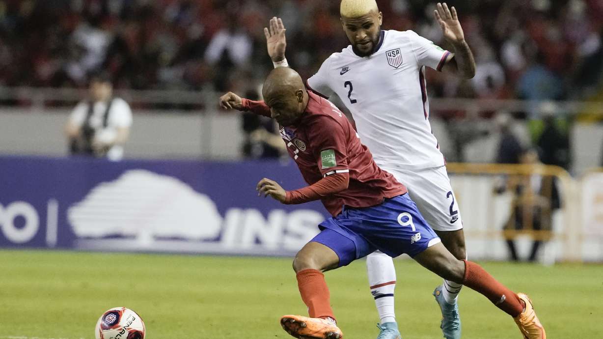 United States' Deandre Yedlin, right, and Costa Rica's Jewison Bennette battle for the ball during a qualifying soccer match for the FIFA World Cup Qatar 2022 in San Jose, Costa Rica, Wednesday, March 30, 2022.
