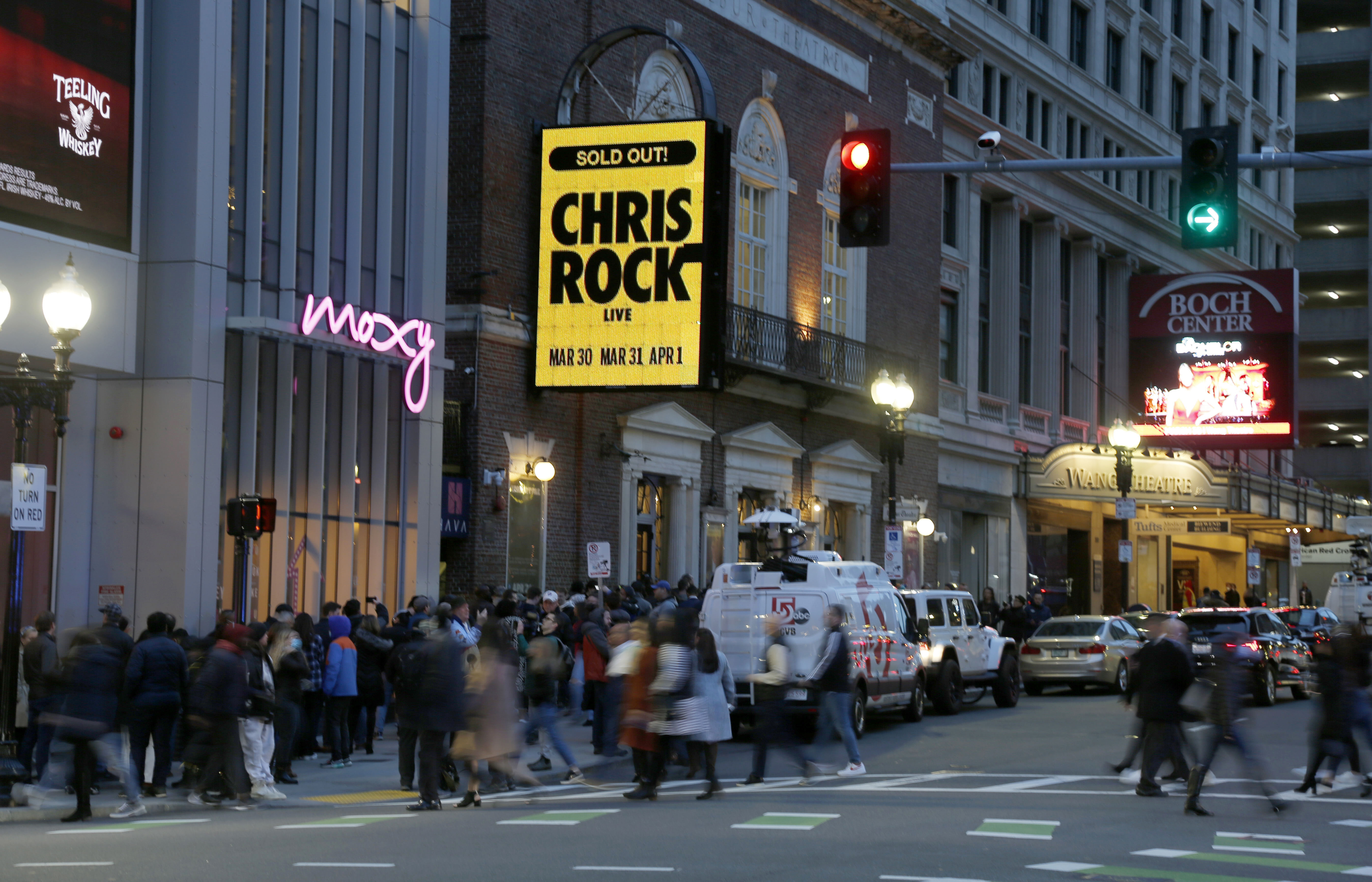The marquee advertises Chris Rock as ticket holders wait to enter outside the Wilbur Theatre, Wednesday, in Boston.