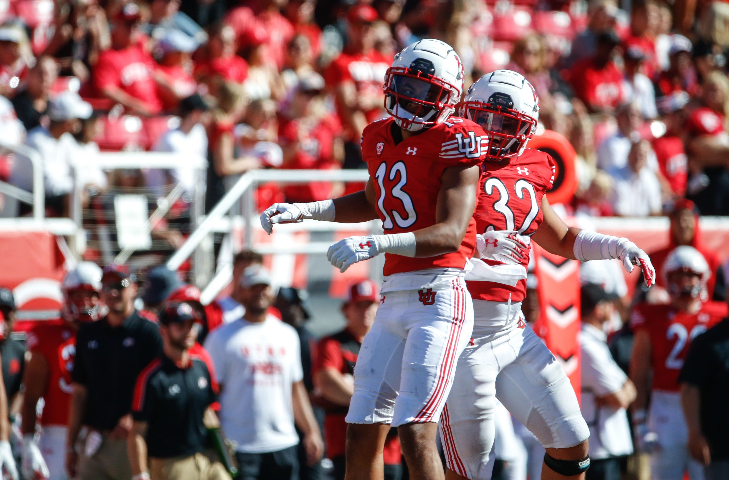 Utah wide receiver Munir McClain (13) and Utah linebacker Karene Reid (32) celebrates the victory against Washington State during an NCAA college football game at Rice-Eccles Stadium on Saturday, Sept. 25, 2021 in Salt Lake City. Utah won the game 24-13.