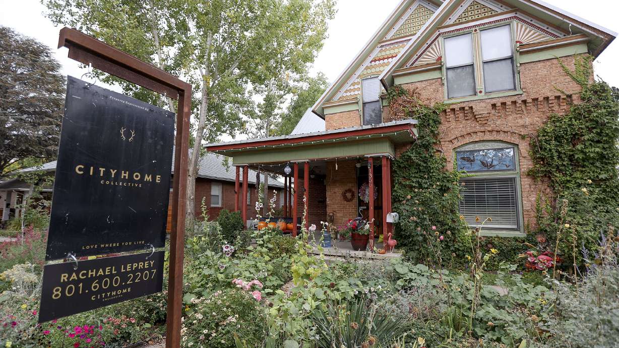 A “for sale” sign is pictured in Salt Lake City on Oct. 18, 2021. Researchers and economists are warning they are seeing signs of a housing bubble brewing.