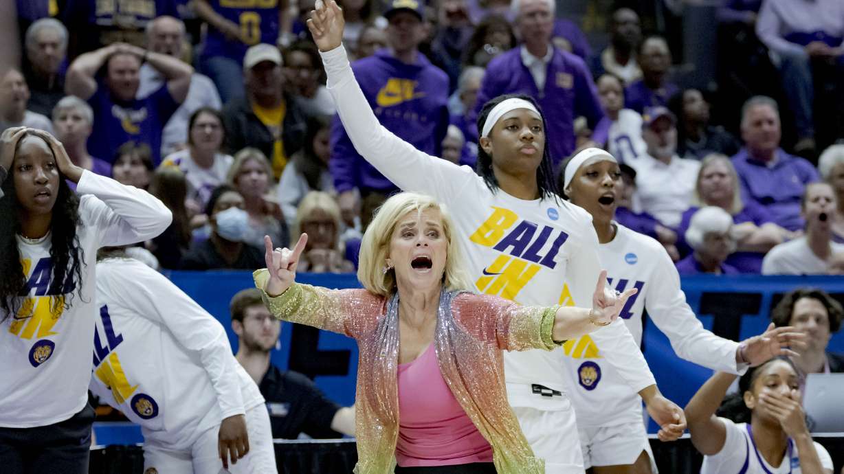 LSU head coach Kim Mulkey, center front, reacts to a call during the second half of a women's college basketball game against Ohio State in the second round of the NCAA tournament, Monday, March 21, 2022, in Baton Rouge, La.