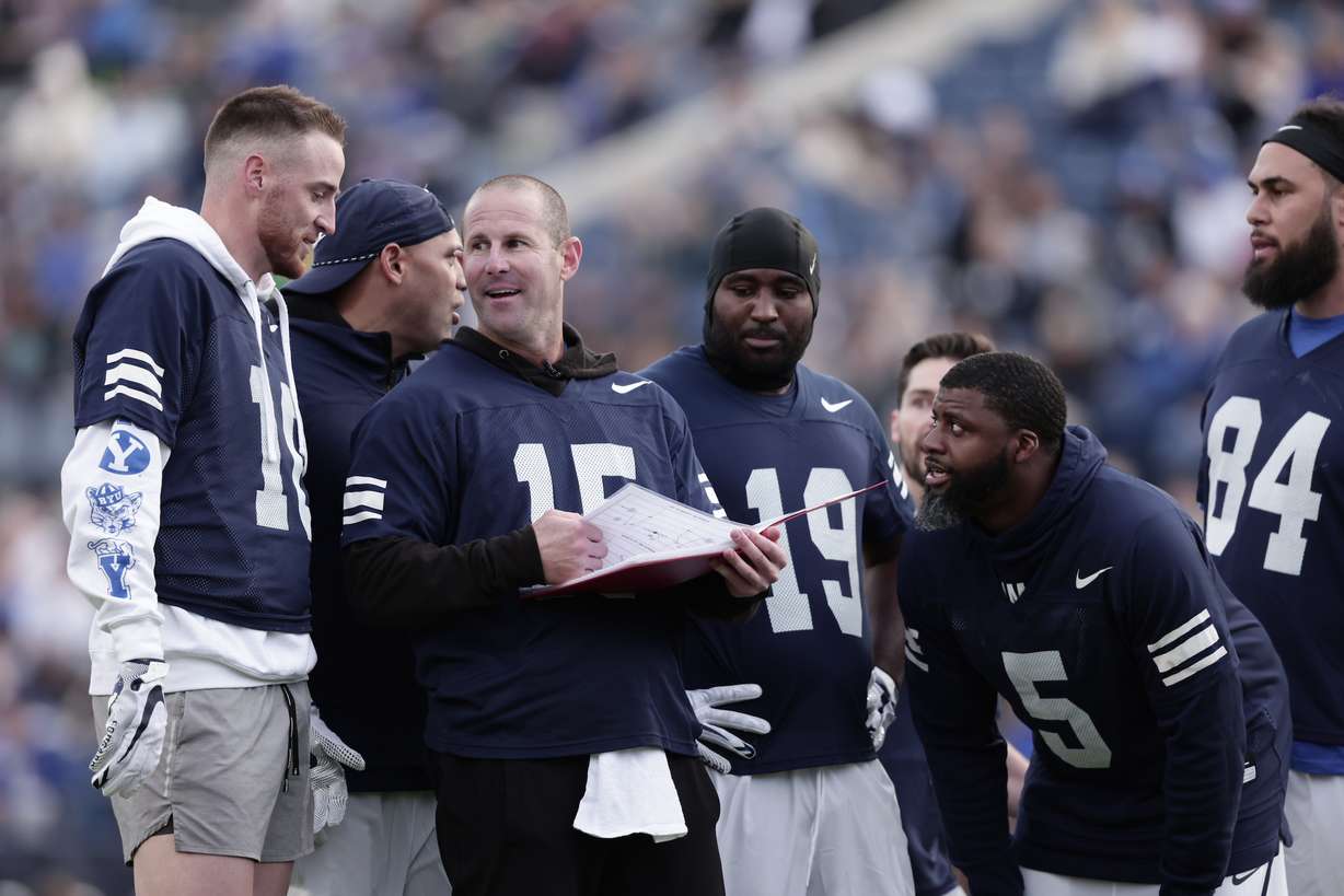 Former BYU football quarterback Max Hall, Mitch Matthews and other players participate in the alumni game at LaVell Edwards Stadium, March 31, 2022 in Provo.