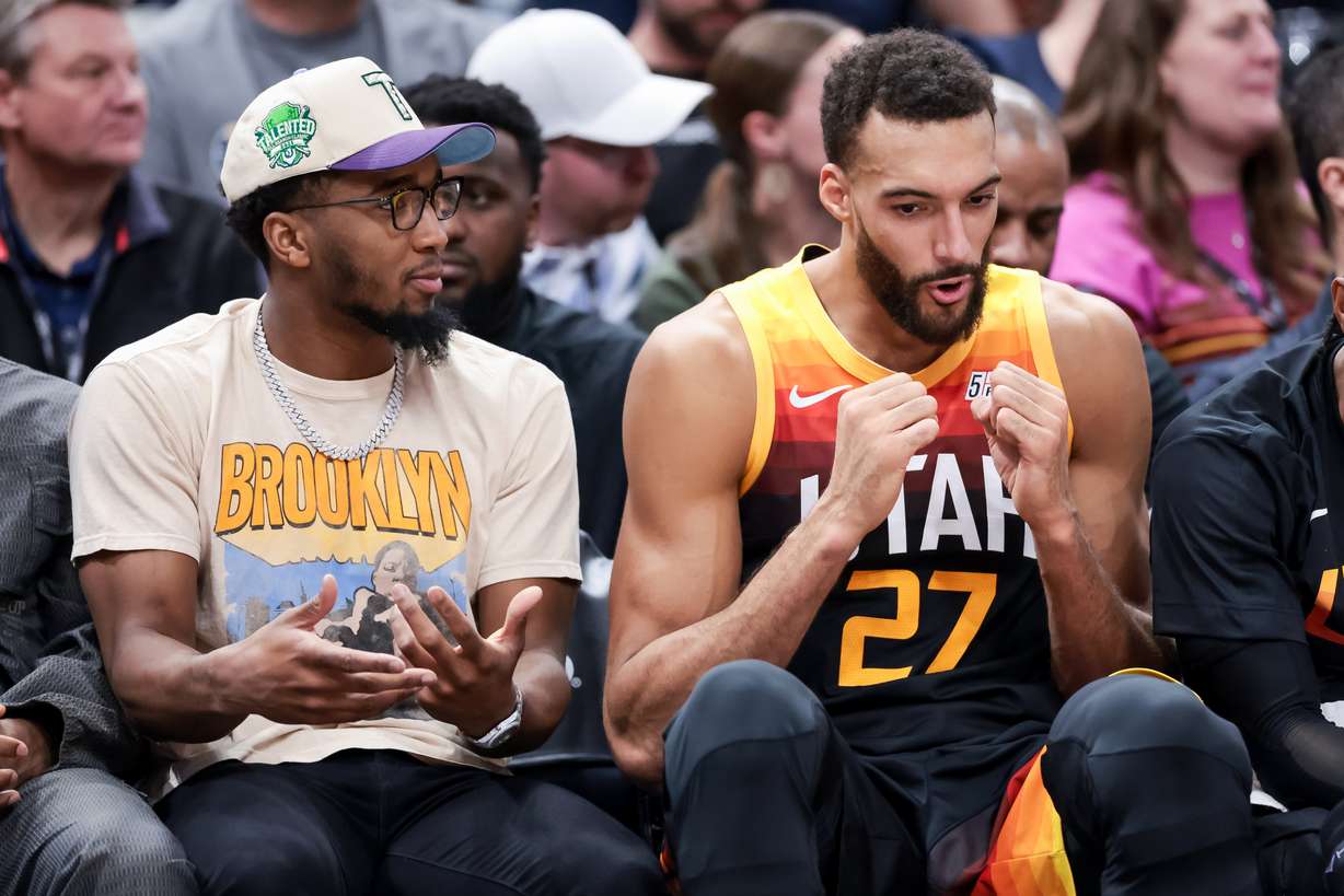 Utah Jazz guard Donovan Mitchell sits with center Rudy Gobert (27) during the game against the LA Clippers at Vivint Arena in Salt Lake City on Friday, March 18, 2022.
