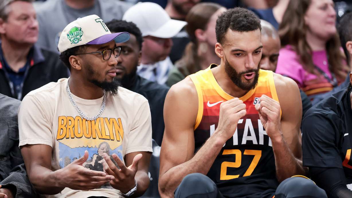 Utah Jazz guard Donovan Mitchell sits with center Rudy Gobert (27) during the game against the LA Clippers at Vivint Arena in Salt Lake City on Friday, March 18, 2022.