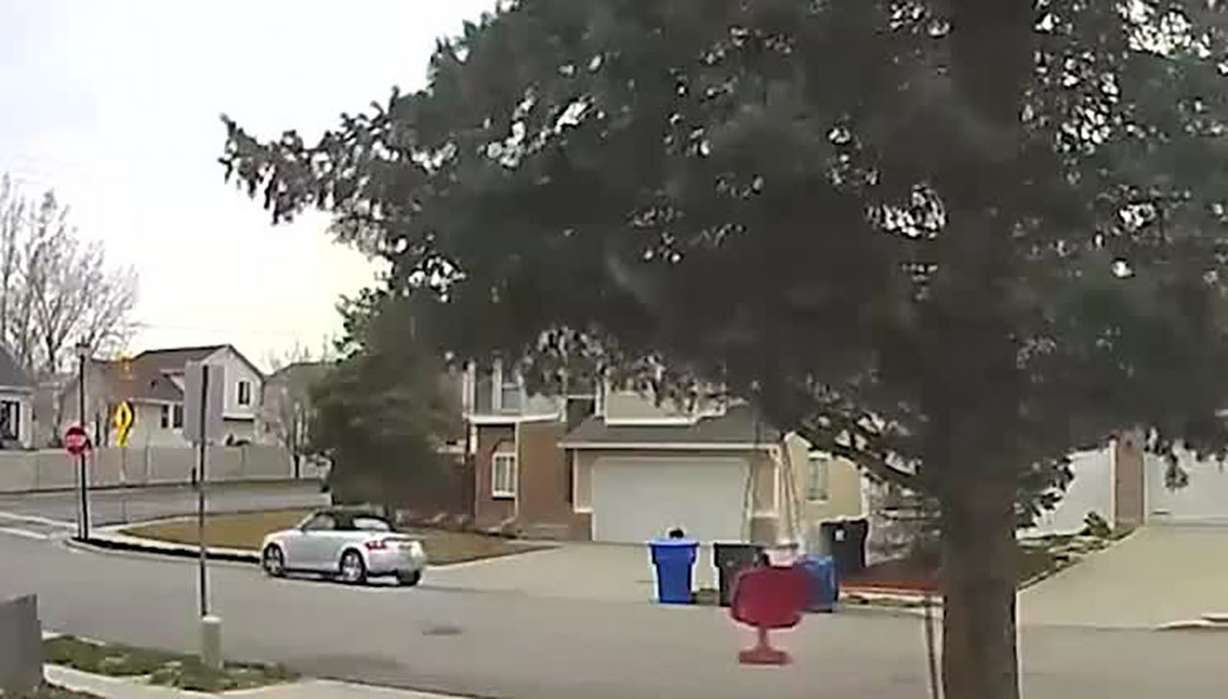 Surveillance video shows a car in front of Olympic skeleton athlete Akwasi Frimpong's house. Frimpong's backpack is in front of his garage before someone stole it.