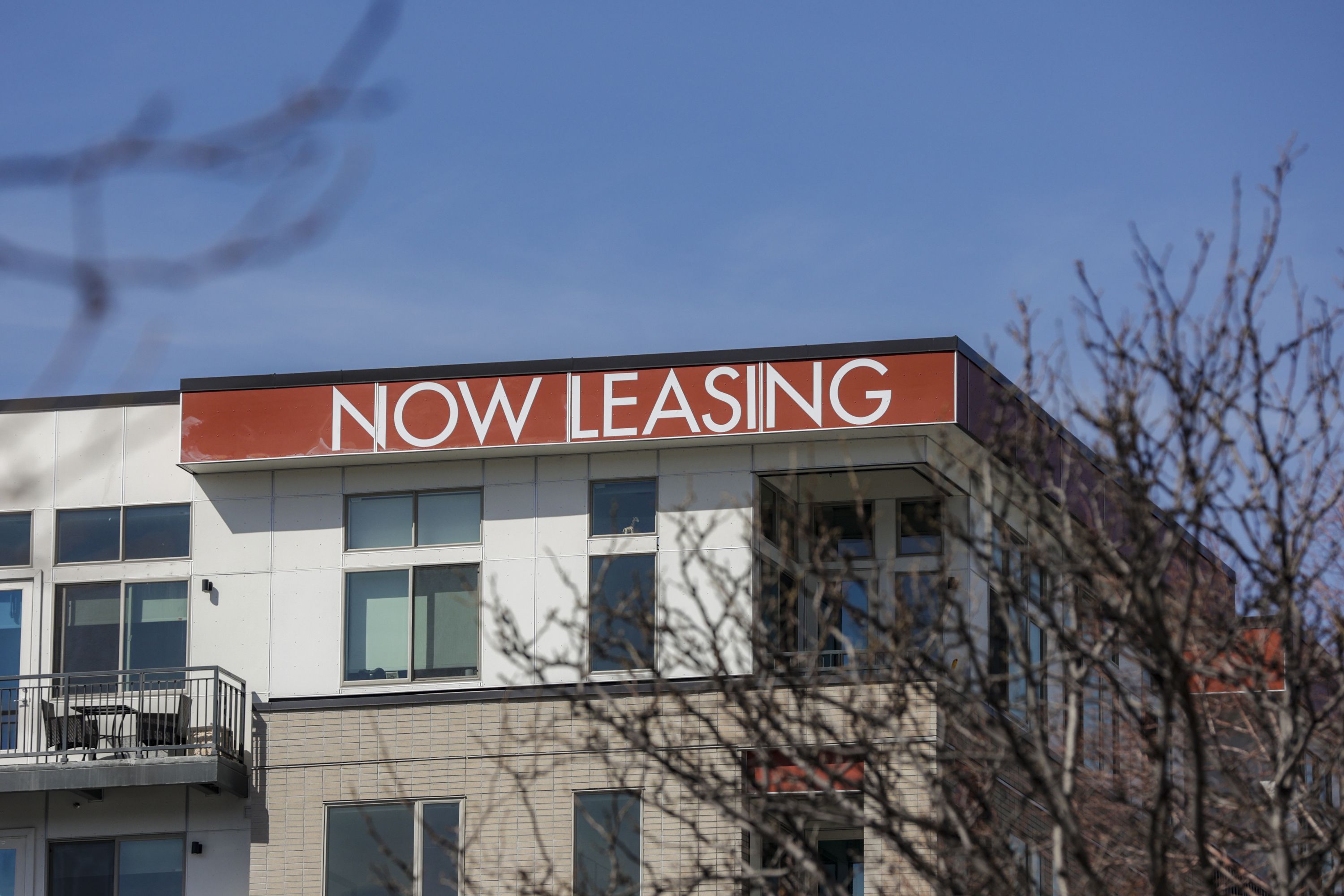 A “now leasing” sign for a new apartment building in the Sugar House neighborhood of Salt Lake City is pictured on Friday, April 1, 2022.