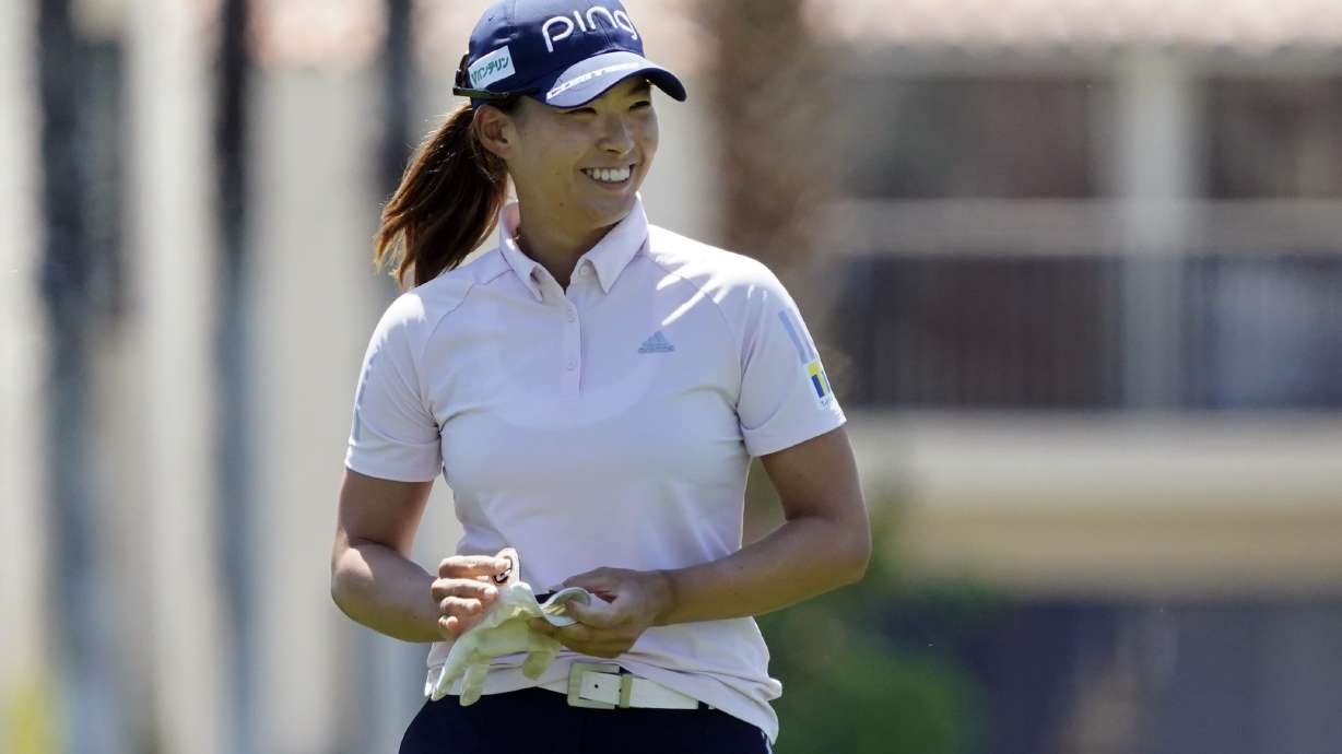 Hinako Shibuno smiles as she walks from the fairway to the 18th hole during the second round of the LPGA Chevron Championship golf tournament Friday, April 1, 2022, in Rancho Mirage, Calif.