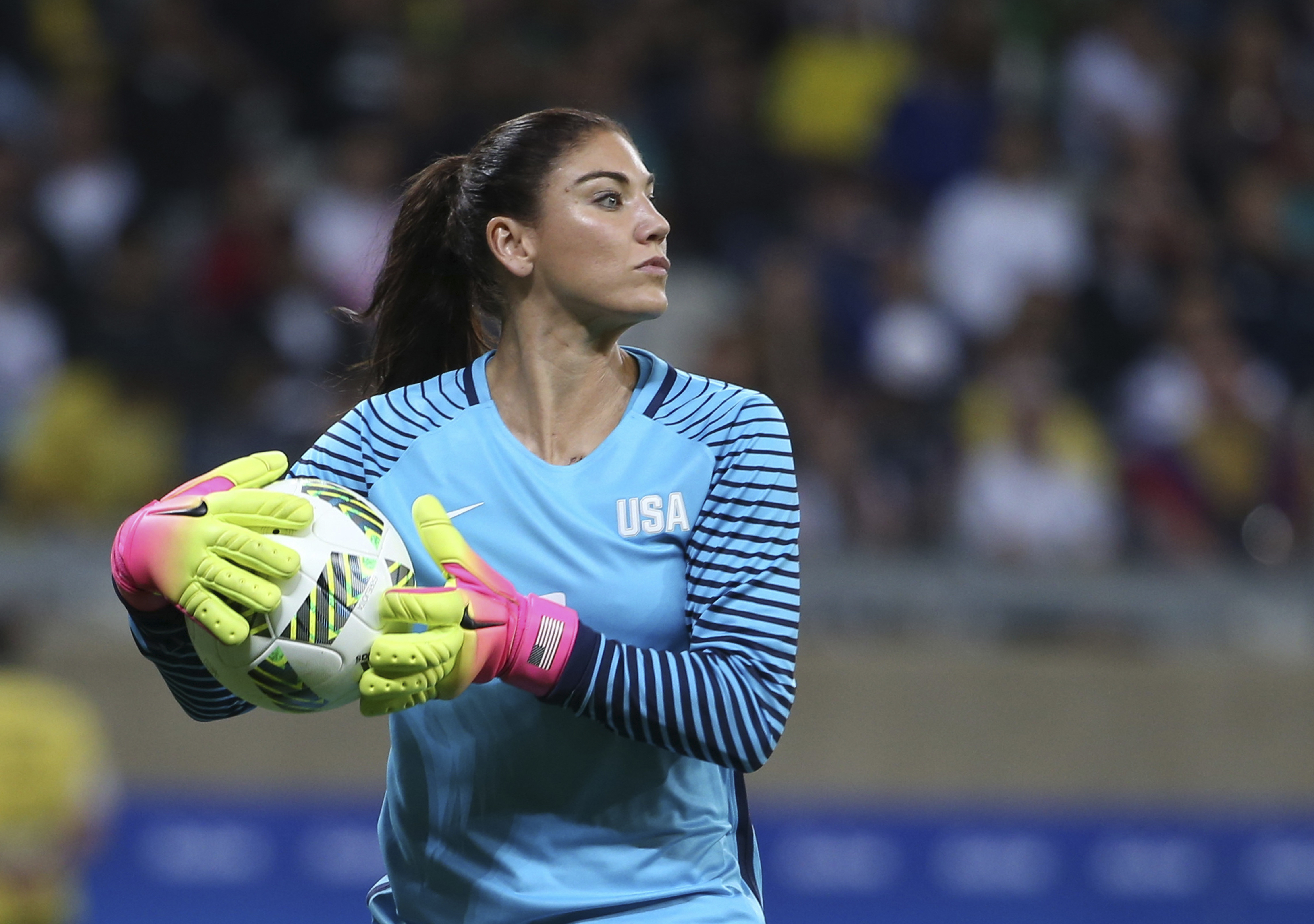 FILE - United States' goalkeeper Hope Solo takes the ball during a women's soccer game at the Rio Olympics against New Zealand in Belo Horizonte, Brazil, Aug. 3, 2016. Former U.S. women’s national team star goalkeeper Solo was arrested after police say she was found passed out behind the wheel of a vehicle in North Carolina with her two children inside. A police report said Solo was arrested on Thursday, March 31, 2022, in a shopping center parking lot in Winston-Salem and charged with driving while impaired, resisting a public officer and misdemeanor child abuse. 