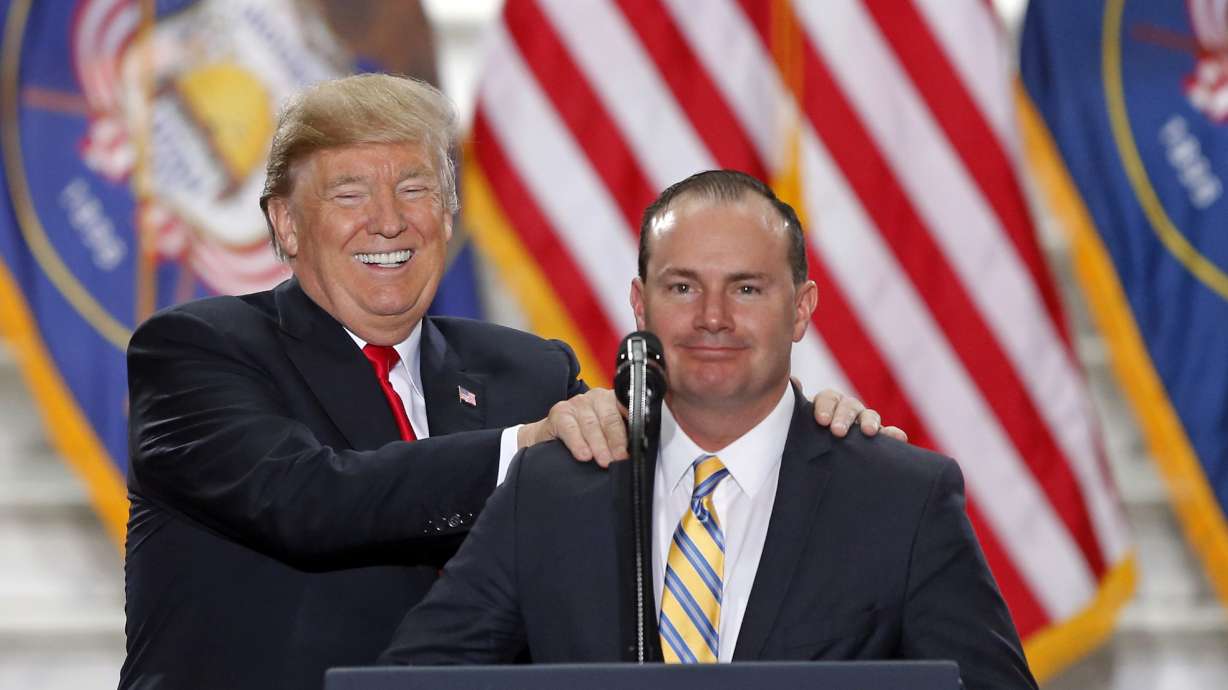 Former President Donald Trump stands with Sen. Mike Lee, R-Utah, at the Utah State Capitol, after Trump traveled to Salt Lake City to announce plans to shrink two sprawling national monuments in Utah on Dec. 4, 2017. Trump endorsed Lee on Friday.