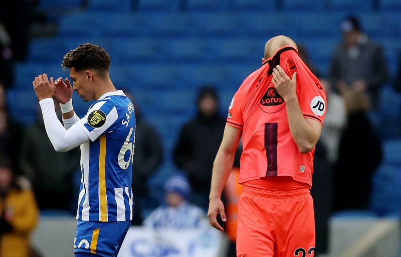 Soccer Football - Premier League - Brighton & Hove Albion v Norwich City - The American Express Community Stadium, Brighton, Britain - April 2, 2022 Brighton & Hove Albion's Jeremy Sarmiento and Norwich City's Teemu Pukki look dejected after the match Action Images via Reuters/Matthew Childs