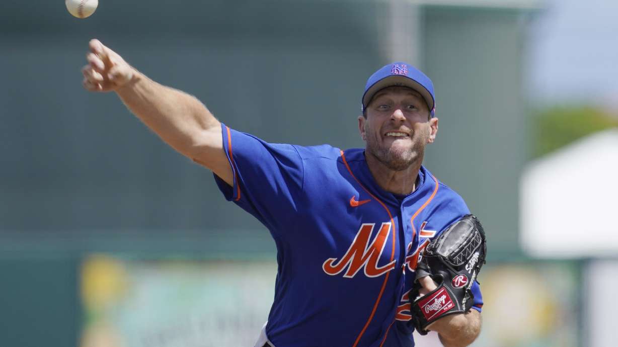 New York Mets' Max Scherzer pitches in the second inning of a spring training baseball game against the Miami Marlins, Monday, March 21, 2022, in Jupiter, Fl.