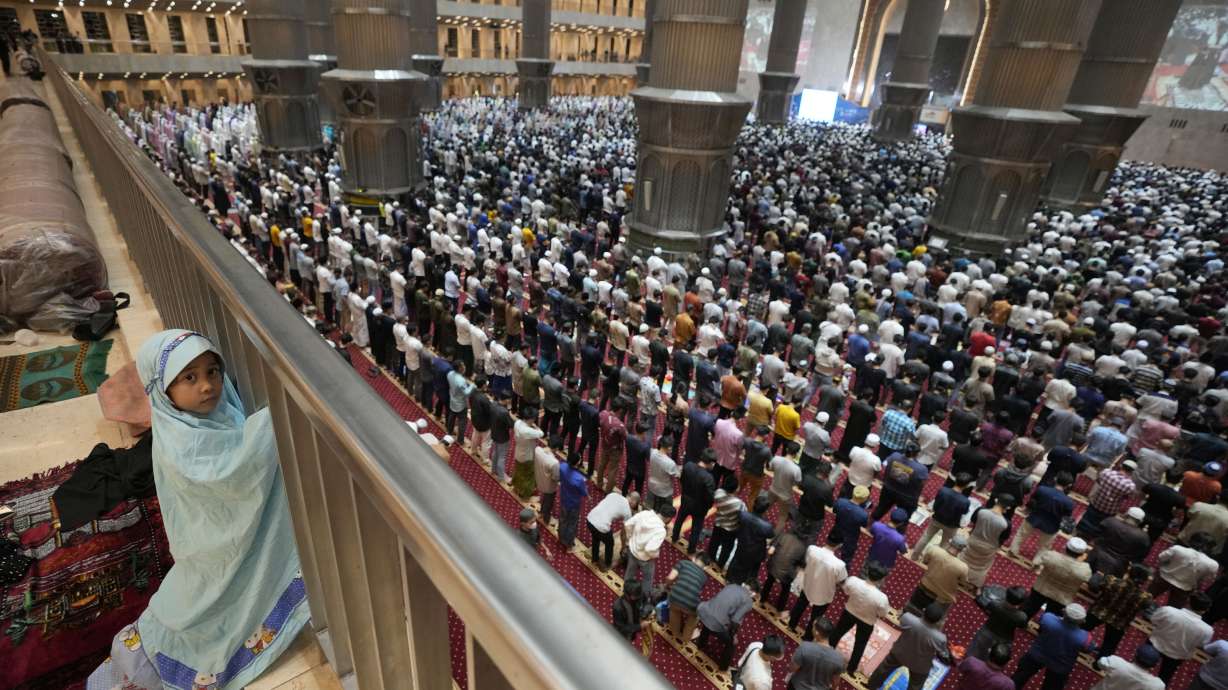 A little girl looks on during an evening prayer on the eve of the holy fasting month of Ramadan at Istiqlal Mosque in Jakarta, Indonesia, Saturday.