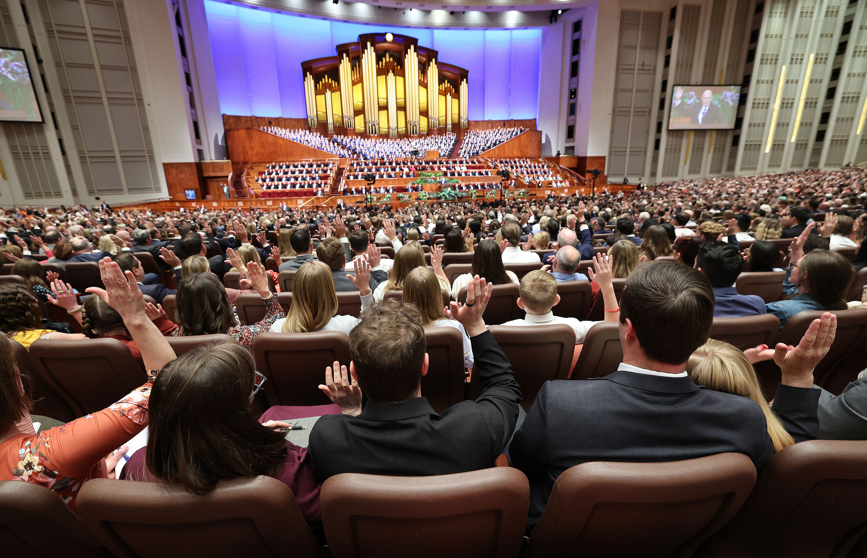 Conferencegoers sustain Latter-day Saint leaders during the Church of Jesus Christ's 192nd Annual General Conference at the Conference Center in Salt Lake City on Saturday.