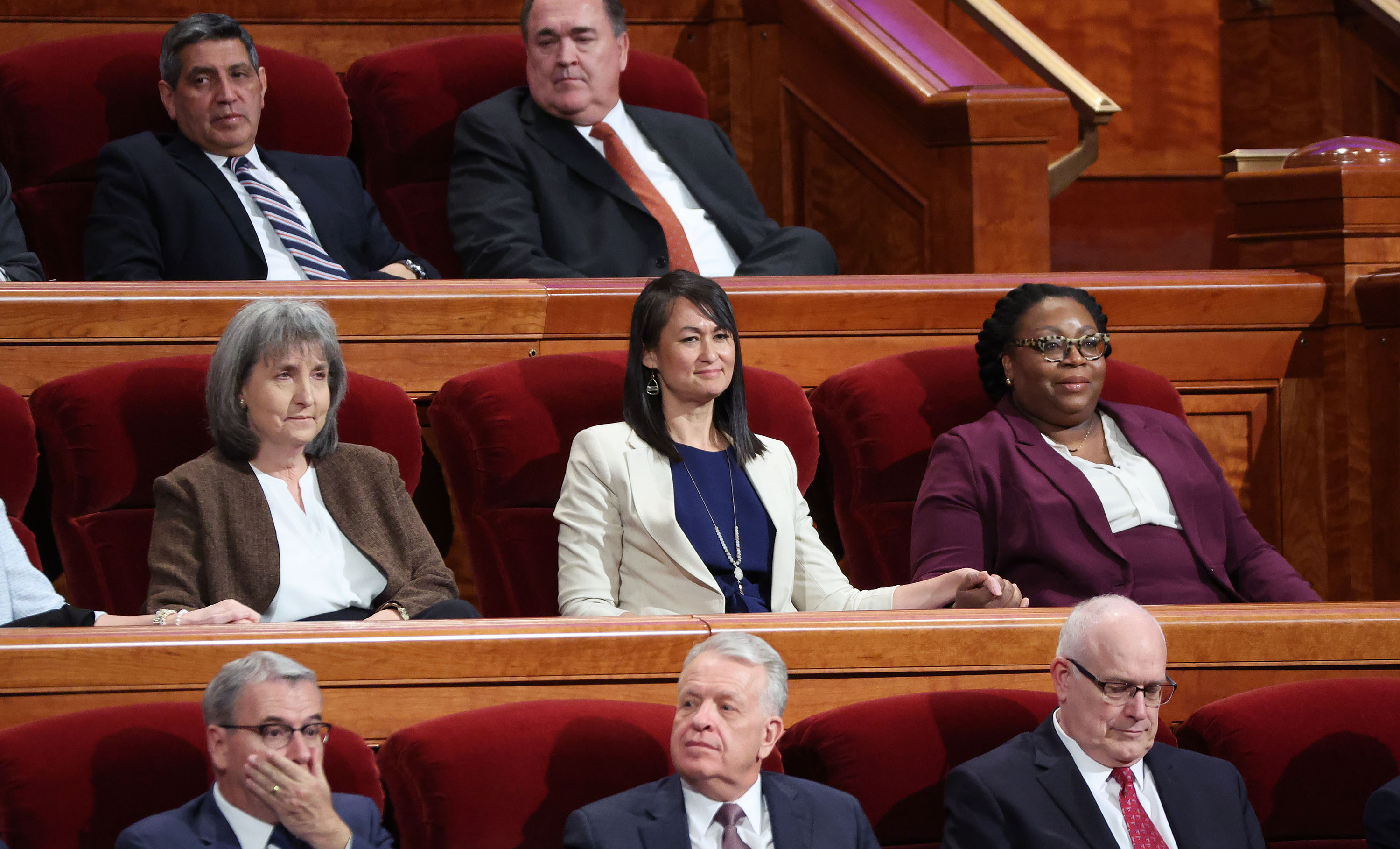 J. Anette Dennis, first counselor of The Church of Jesus Christ of Latter-day Saints' Relief Society, center left, Sister Kristin M. Yee, second counselor of the Relief Society general presidency, and Sister Tracy Y. Browning, second counselor in the Primary general presidency, take their seats during the church's 192nd Annual General Conference at the Conference Center in Salt Lake City on Saturday.