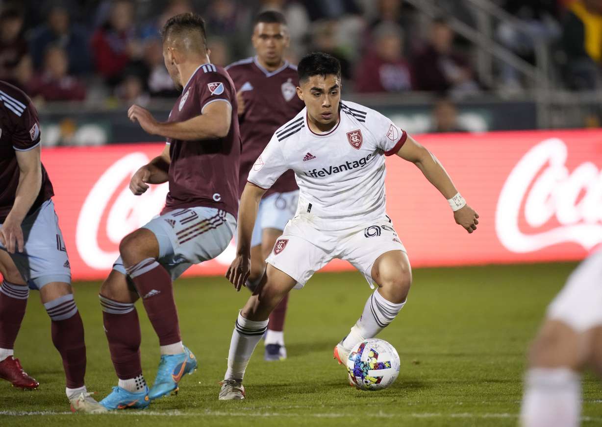 Real Salt Lake defender Jaziel Orozco, right, drives with the ball past Colorado Rapids forward Diego Rubio in the second half of an MLS soccer match Saturday, April 2, 2022, in Commerce City, Colo.