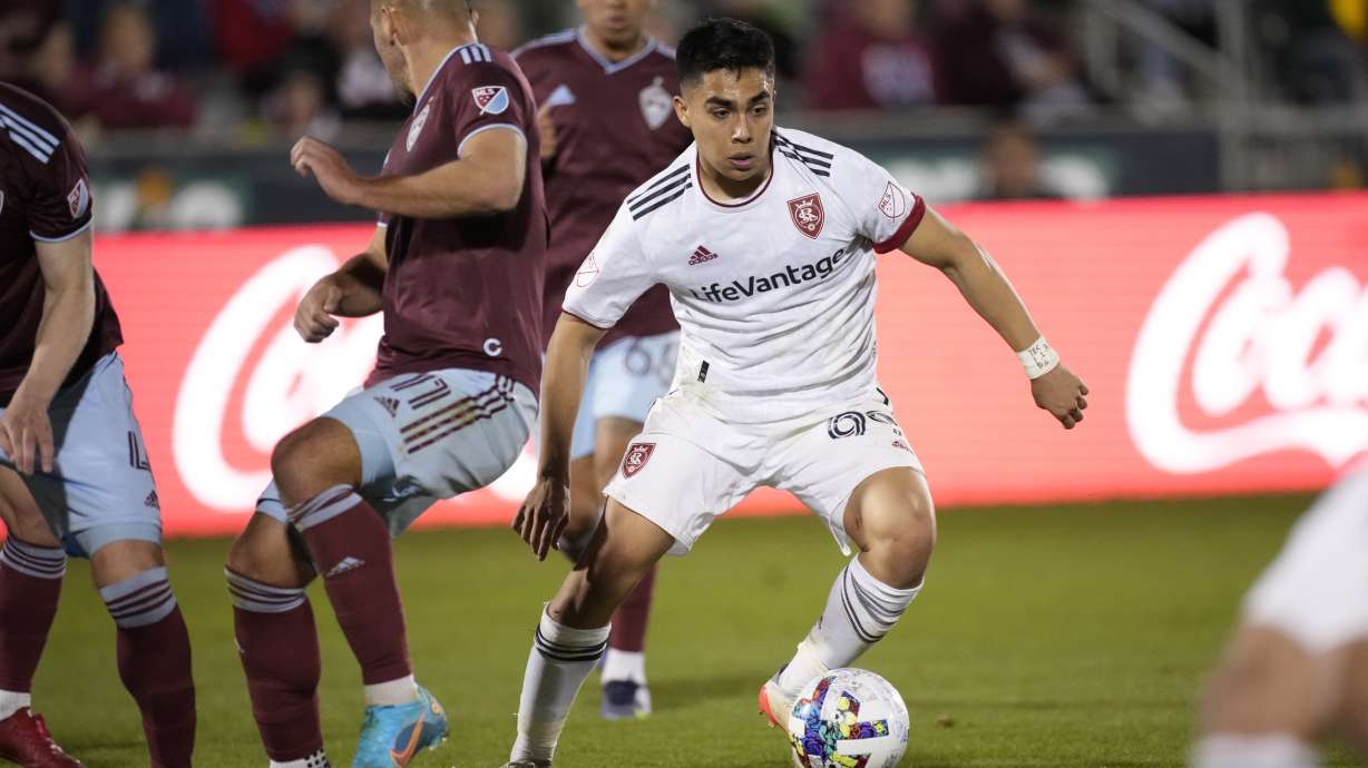 Real Salt Lake defender Jaziel Orozco, right, drives with the ball past Colorado Rapids forward Diego Rubio in the second half of an MLS soccer match Saturday, April 2, 2022, in Commerce City, Colo.