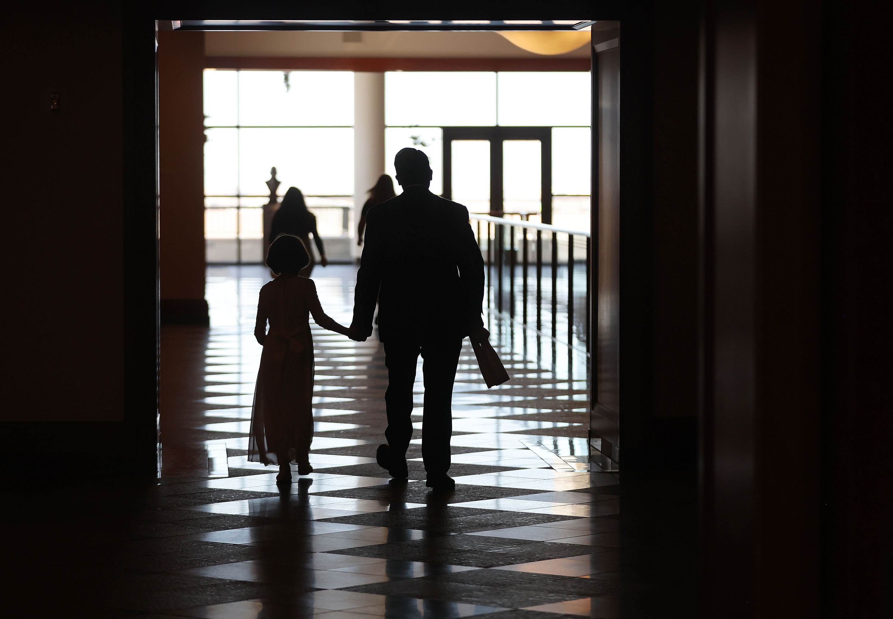 Attendees walk through the conference center during the 192nd Annual General Conference of The Church of Jesus Christ of Latter-day Saints in Salt Lake City on Sunday.