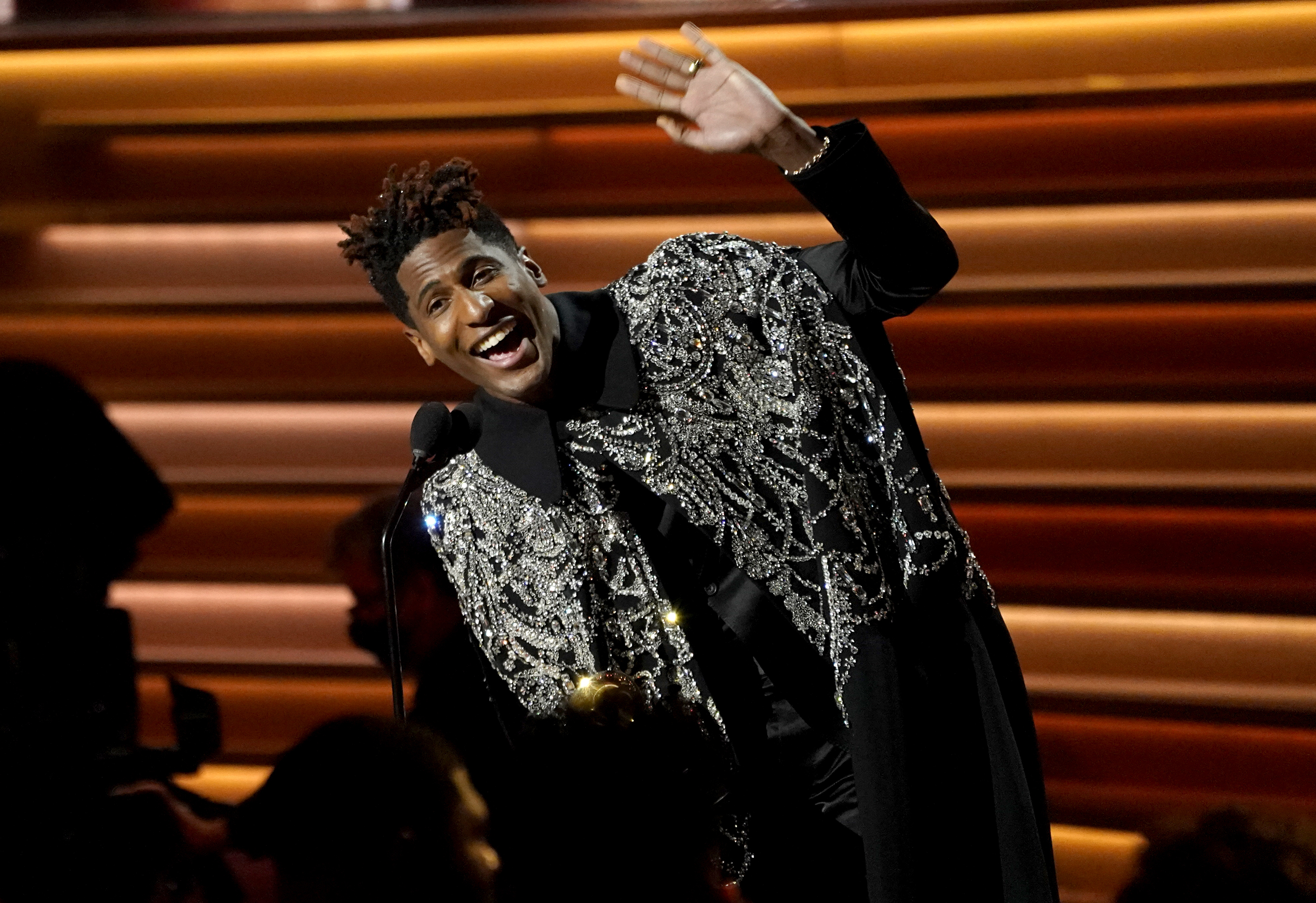 Jon Batiste accepts the award for album of the year for "We Are" at the 64th Annual Grammy Awards on Sunday, in Las Vegas.