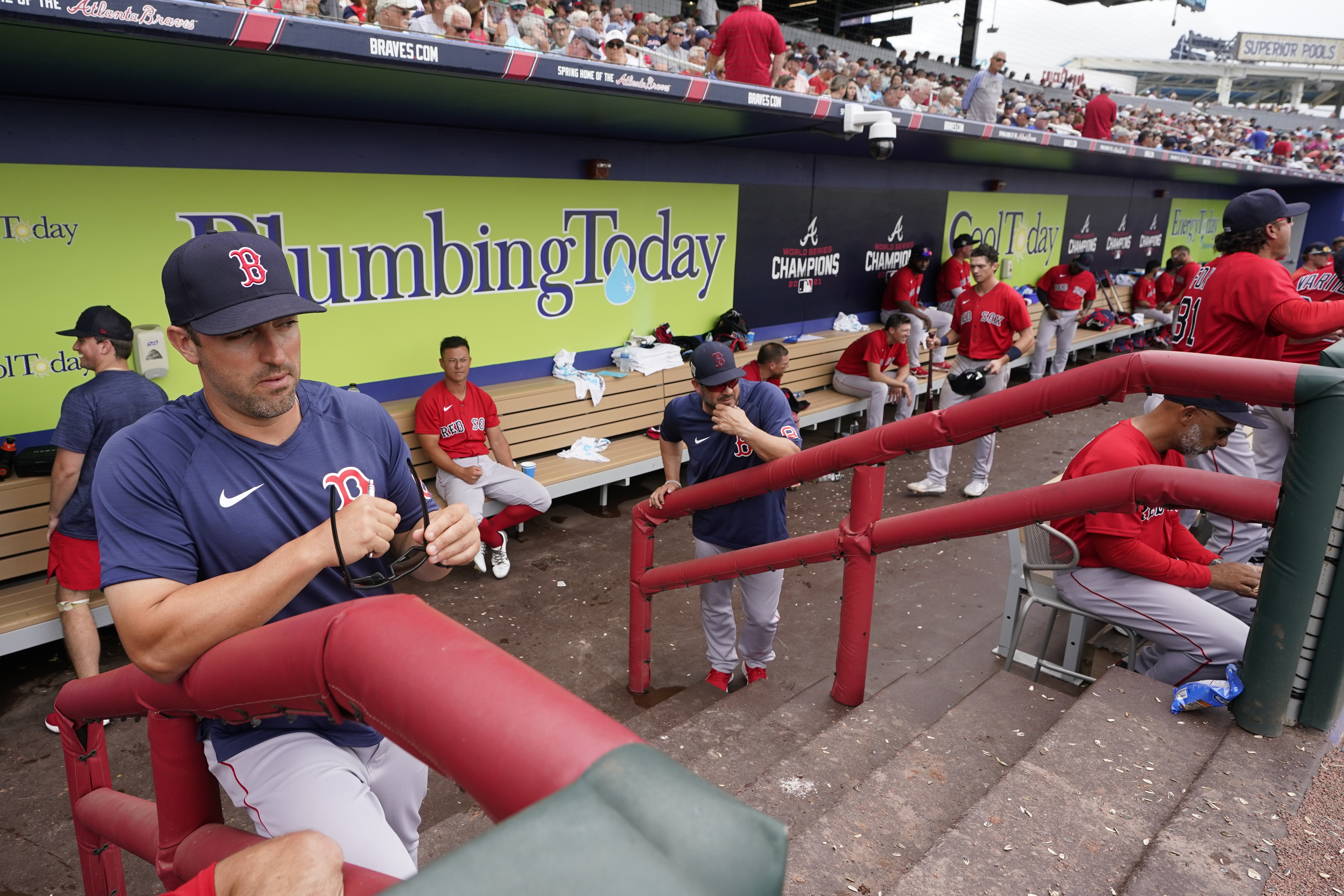 Boston Red Sox hitting coach Peter Fatse (62) watches the warmup in the fourth inning from the dugout during a spring training baseball game against the Atlanta Braves at CoolToday Park, Sunday, April 3, 2022, in North Port, Fla. 