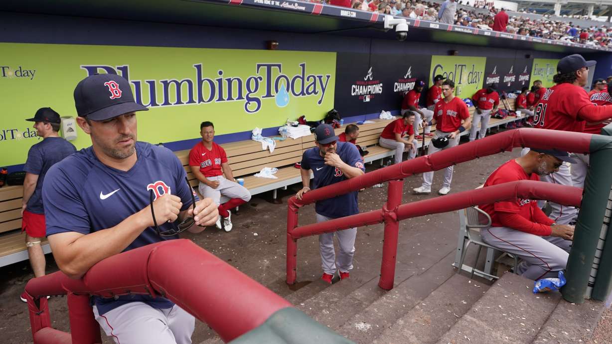 Boston Red Sox hitting coach Peter Fatse (62) watches the warmup in the fourth inning from the dugout during a spring training baseball game against the Atlanta Braves at CoolToday Park, Sunday, April 3, 2022, in North Port, Fla.