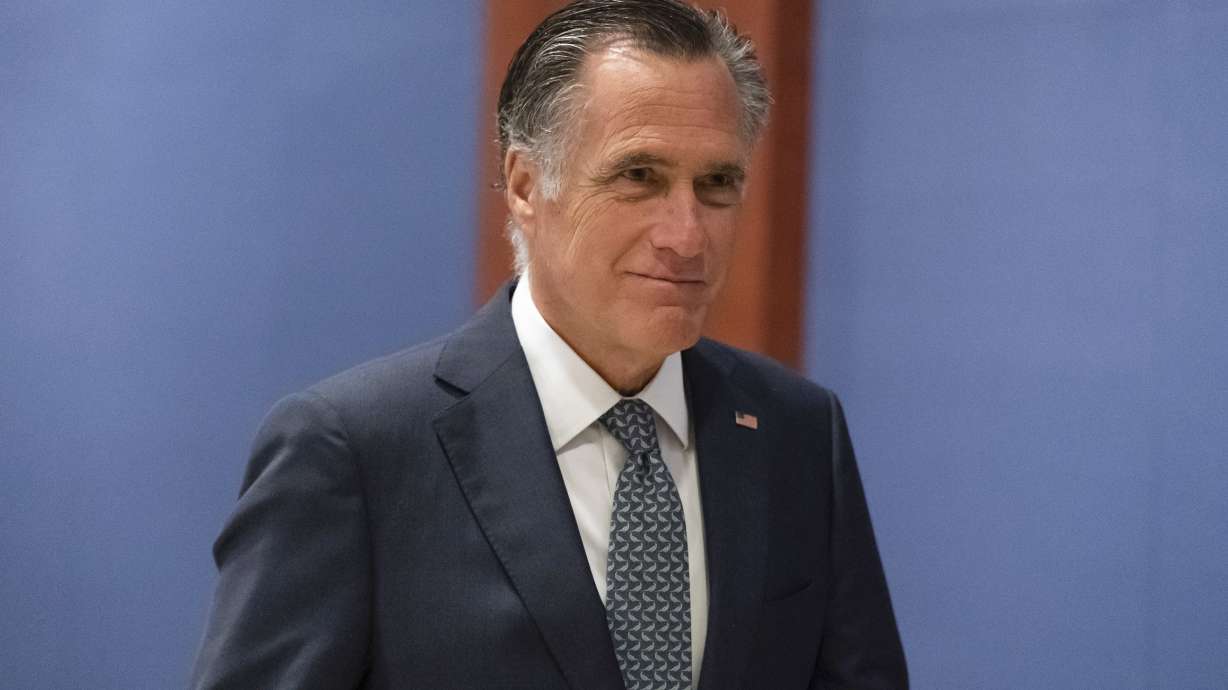 Sen. Mitt Romney, R-Utah, arrives to watch a speech by Ukrainian President Volodymyr Zelenskyy live-streamed into the U.S. Capitol, in Washington, March 16. Romney and other Senate bargainers reached agreement Monday on a slimmed-down $10 billion package for countering COVID-19 with treatments, vaccines and other steps.