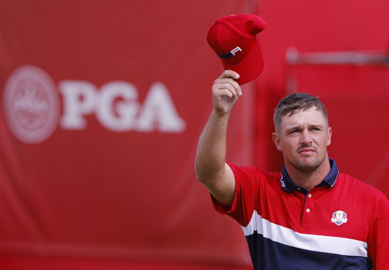 Golf - The 2020 Ryder Cup - Whistling Straits, Sheboygan, Wisconsin, U.S. - September 26, 2021 Team USA's Bryson DeChambeau reacts after holing his putt on the 9th green to win the hole during the Singles