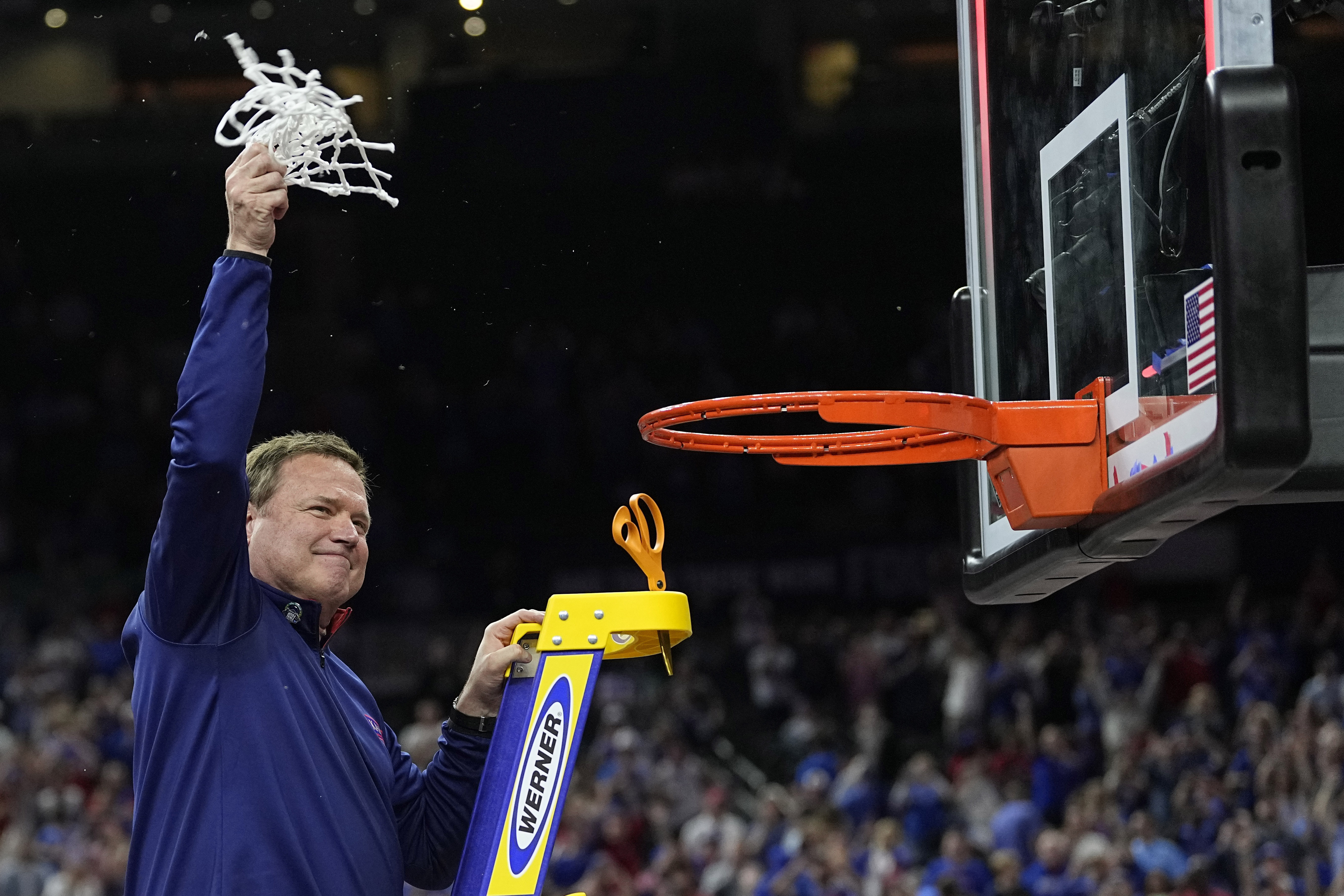 Kansas head coach Bill Self cuts the net after their win against North Carolina in a college basketball game at the finals of the Men's Final Four NCAA tournament, Monday, April 4, 2022, in New Orleans.