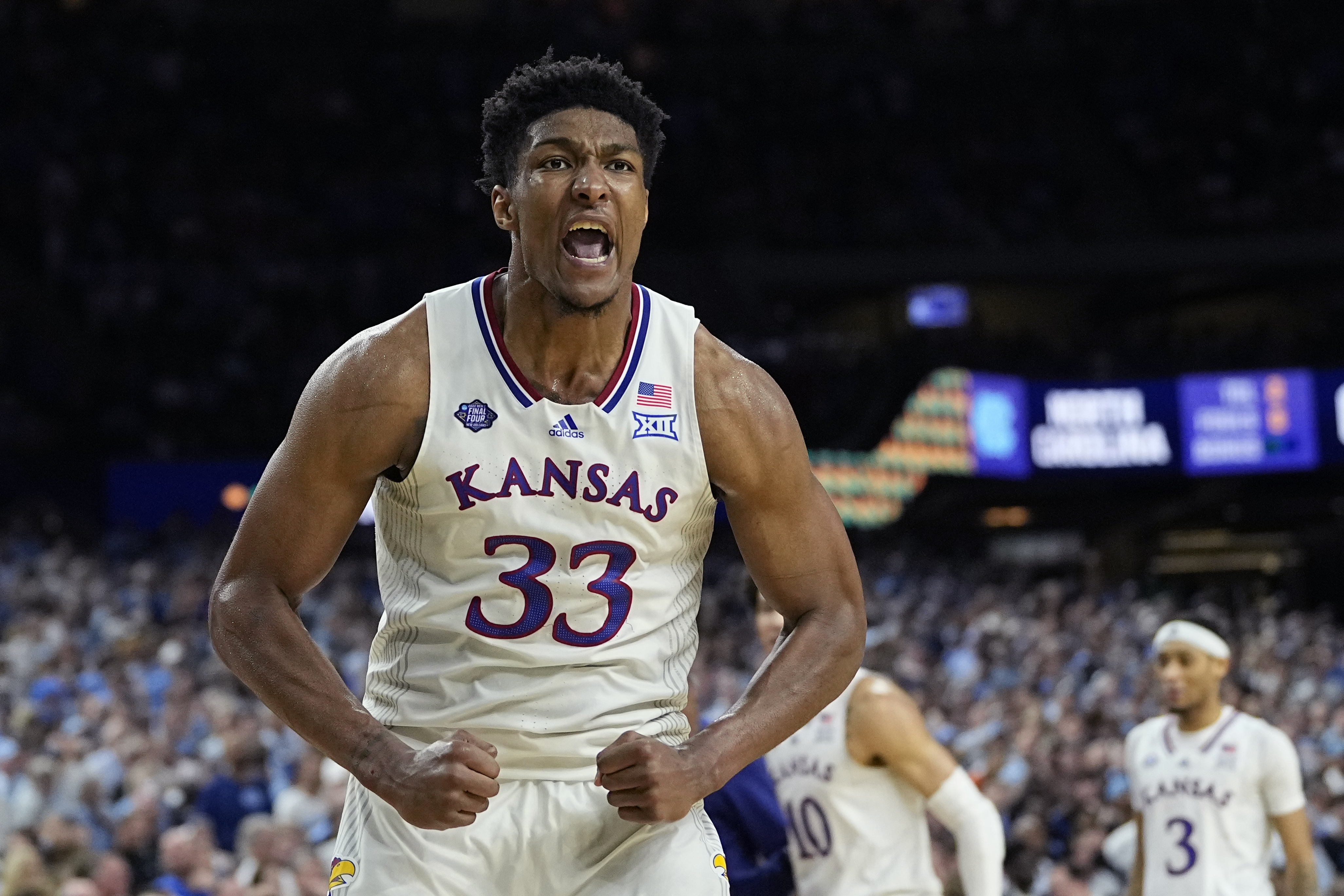 Kansas forward David McCormack celebrates after scoring against North Carolina during the second half of a college basketball game in the finals of the Men's Final Four NCAA tournament, Monday, April 4, 2022, in New Orleans.
