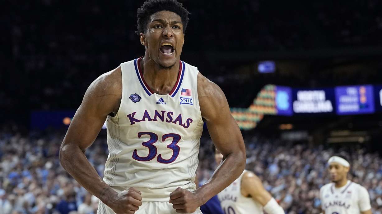 Kansas forward David McCormack celebrates after scoring against North Carolina during the second half of a college basketball game in the finals of the Men's Final Four NCAA tournament, Monday, April 4, 2022, in New Orleans.