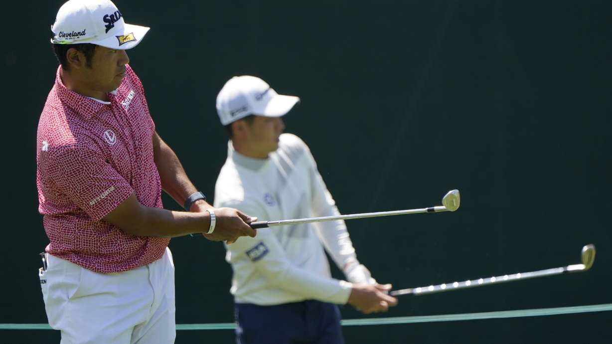 Hideki Matsuyama, of Japan, and Amateur Keita Nakajima, of Japan, hit shots on the 15th hole during a practice round for the Masters golf tournament on Monday, April 4, 2022, in Augusta, Ga.