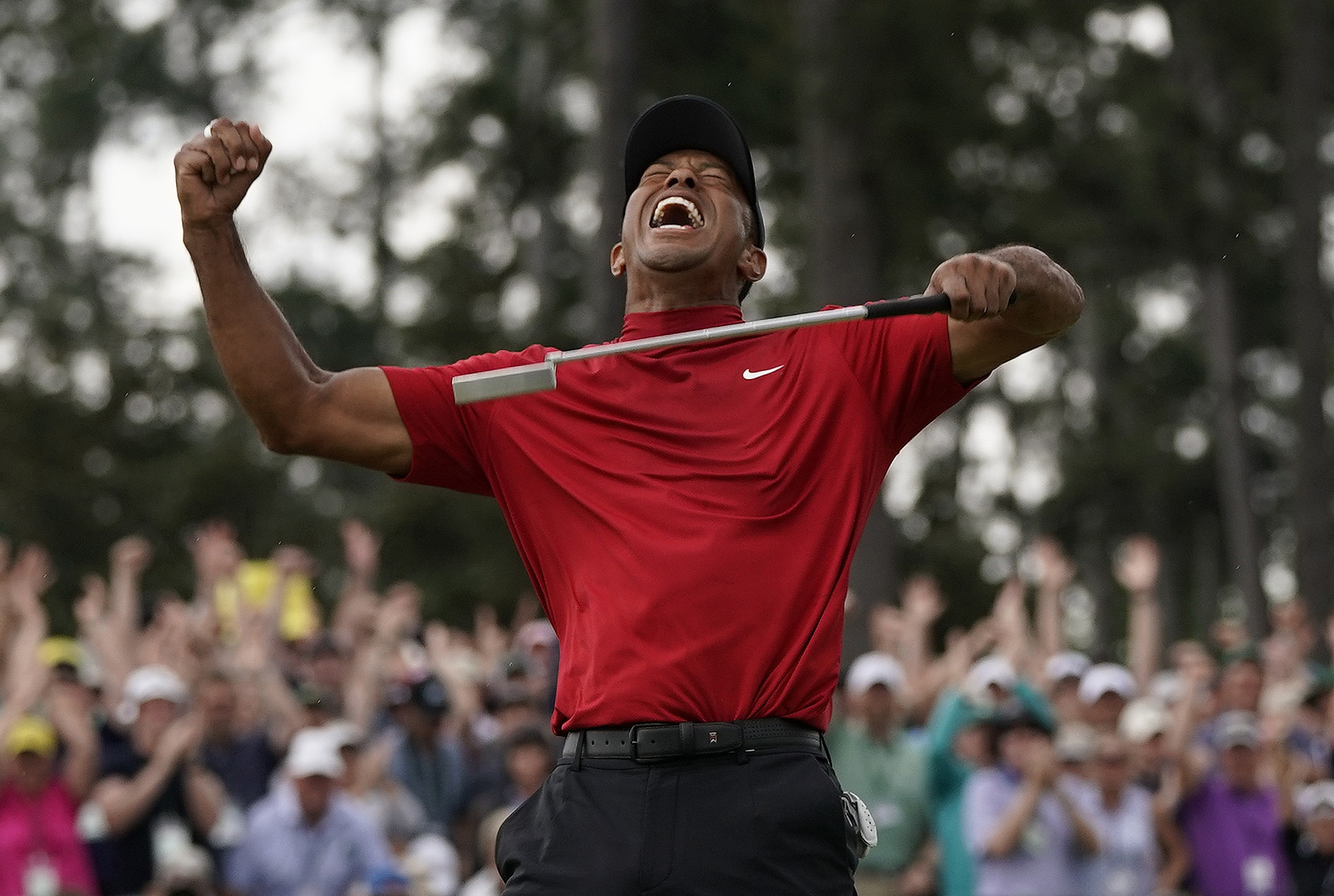 FILE - Tiger Woods reacts as he wins the Masters golf tournament Sunday, April 14, 2019, in Augusta, Ga. In a survey, this rated as his second-most significant win of his five Masters titles. 