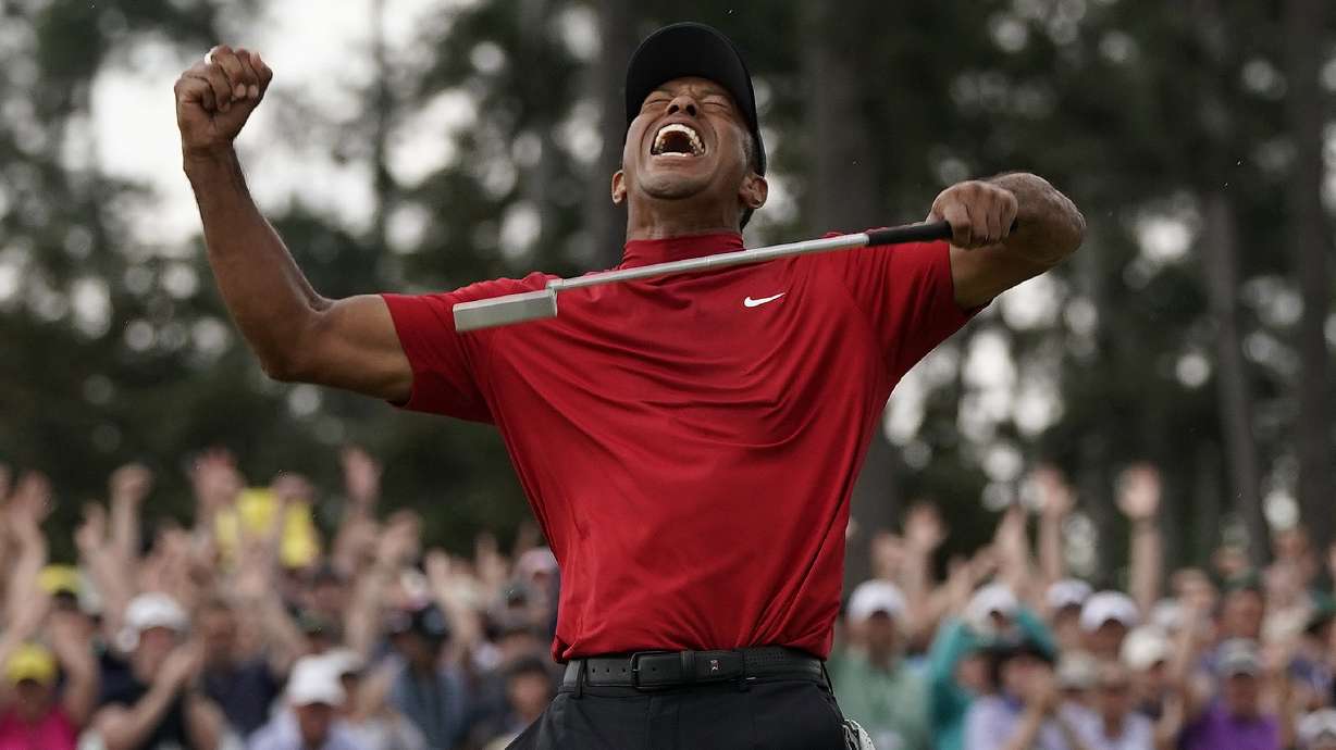 FILE - Tiger Woods reacts as he wins the Masters golf tournament Sunday, April 14, 2019, in Augusta, Ga. In a survey, this rated as his second-most significant win of his five Masters titles.