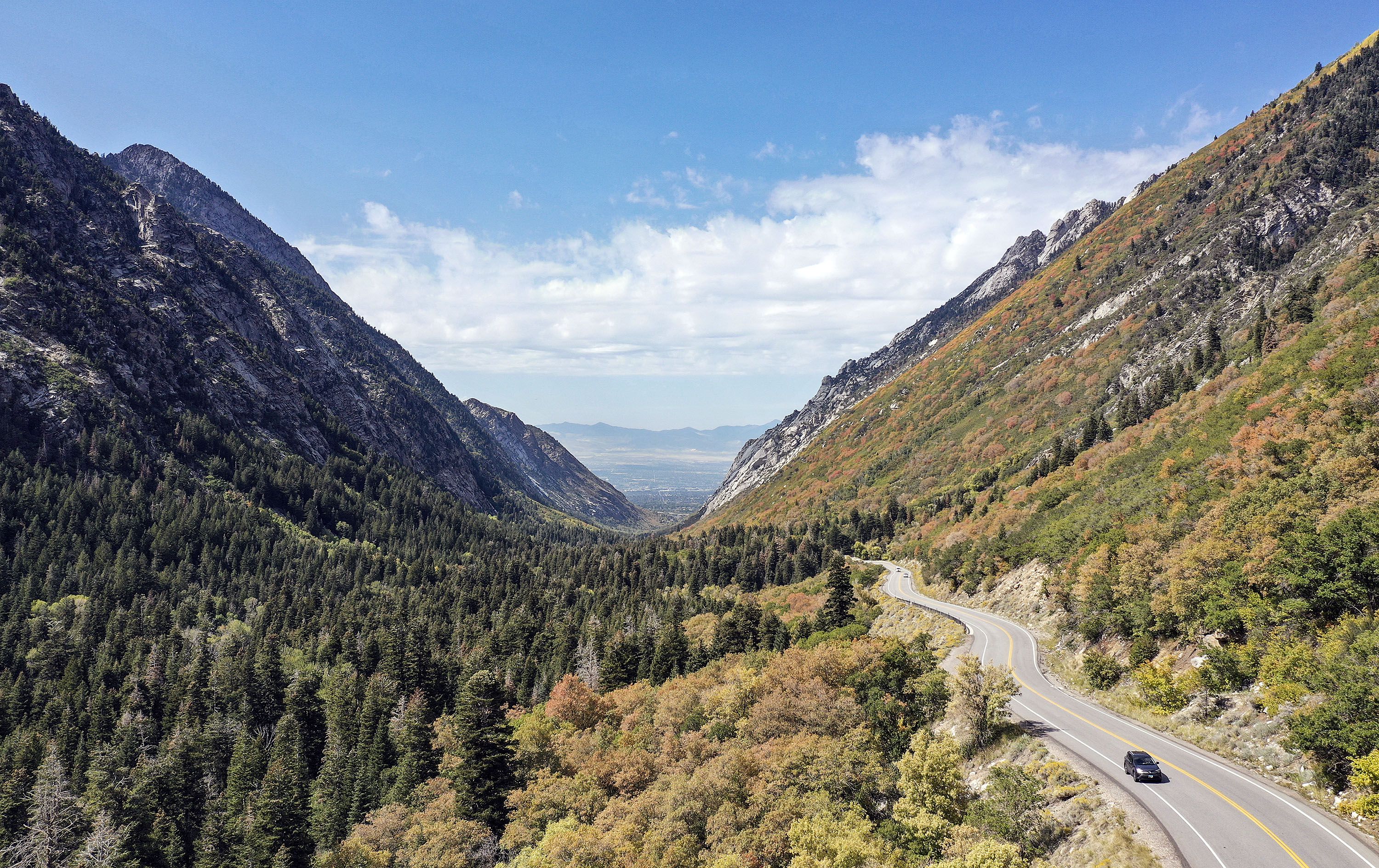 A car drives up Little Cottonwood Canyon on Sept. 23, 2021. The Utah Department of Transportation announced a delay Tuesday in its yearslong search for a traffic solution in the canyon.