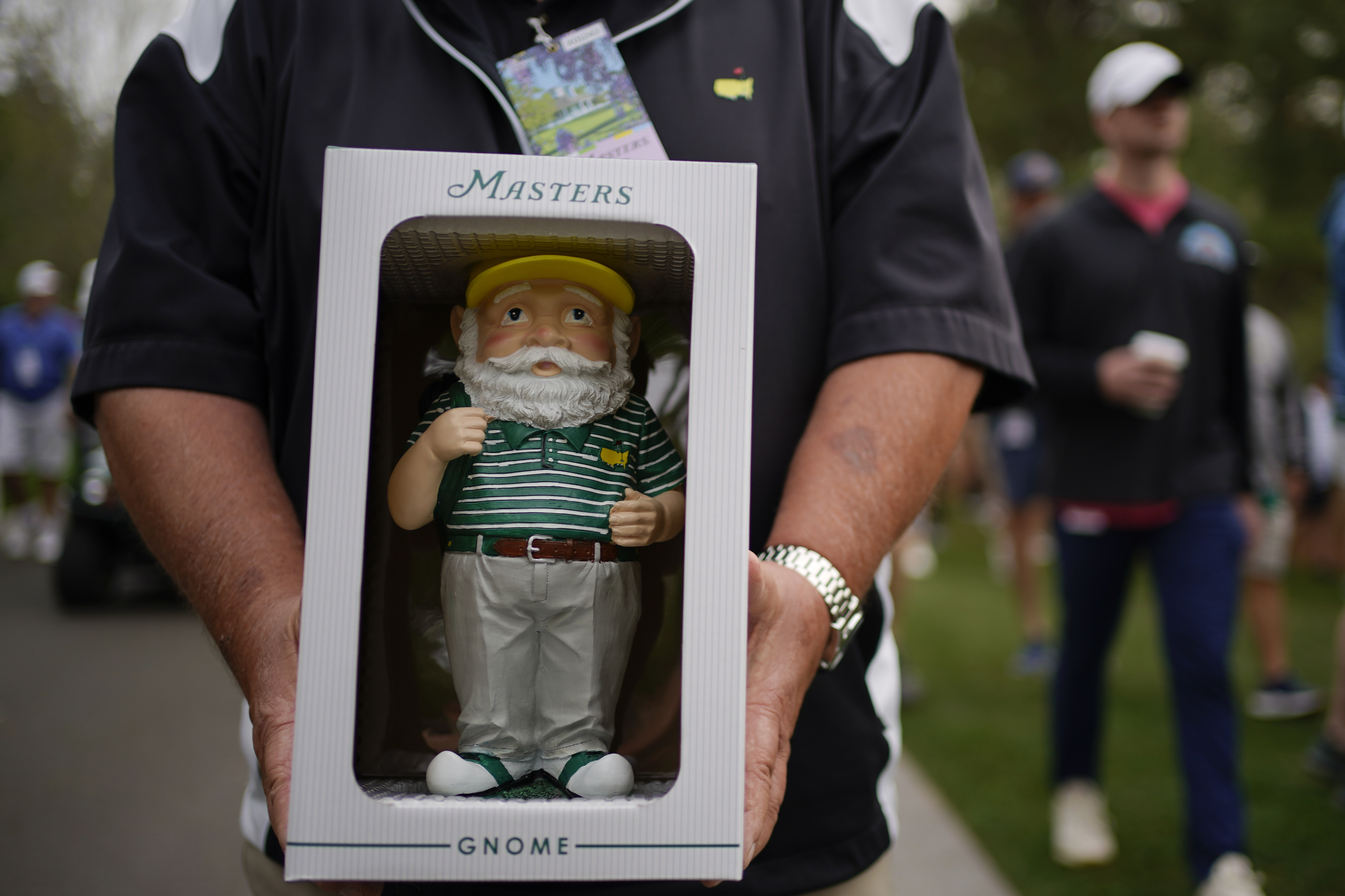 Dan Szatkowski, North Augusta, S.C, poses with his newly purchased garden gnome during a practice round for the Masters golf tournament on Tuesday, April 5, 2022, in Augusta, Ga. 