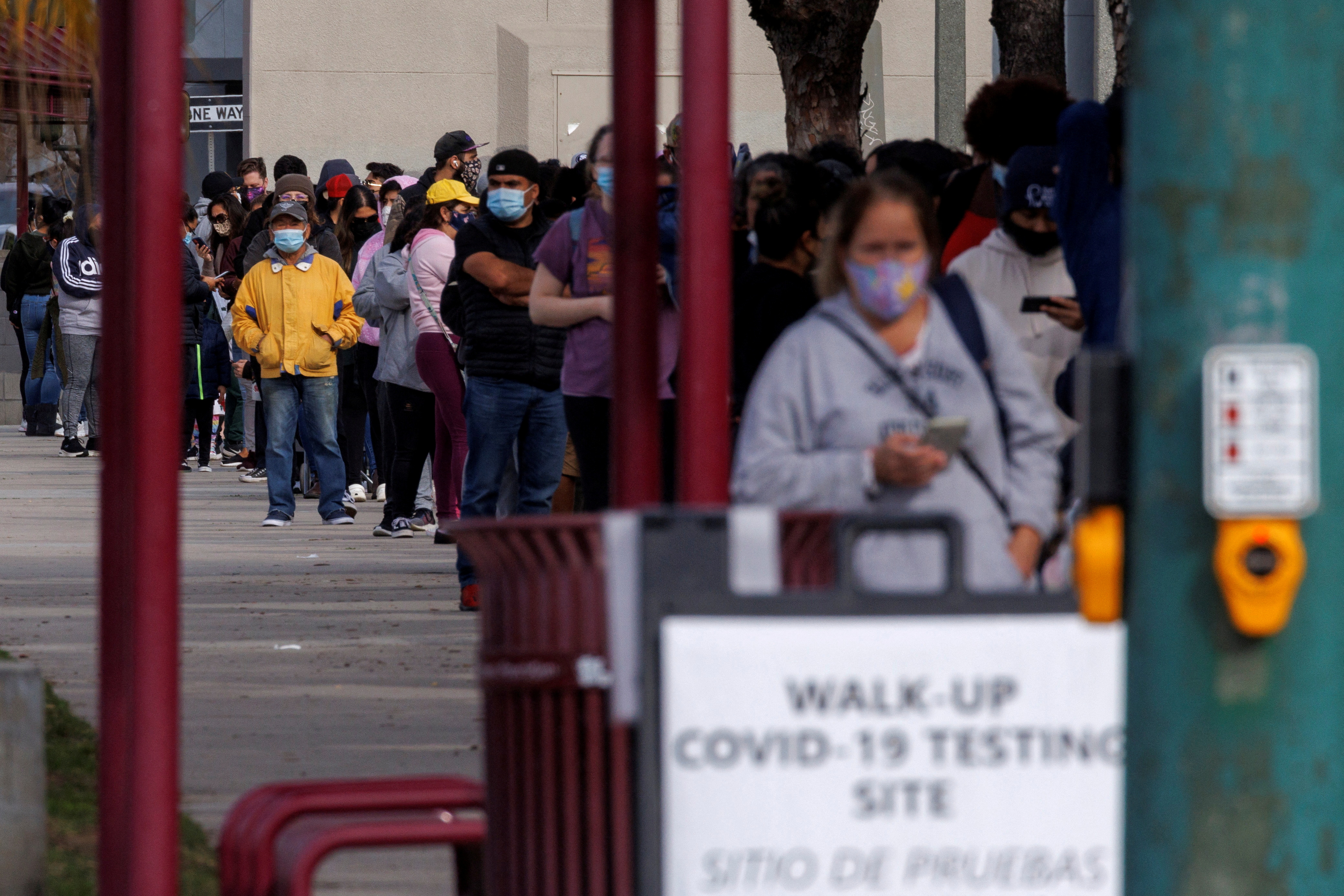 People wait outside a community center as long lines continue for individuals trying to be tested for COVID-19 during the outbreak of the coronavirus disease in San Diego, California, Jan. 10. President Joe Biden on Tuesday announced a national action plan to be developed by the U.S. health department to tackle the looming health crisis of long COVID.