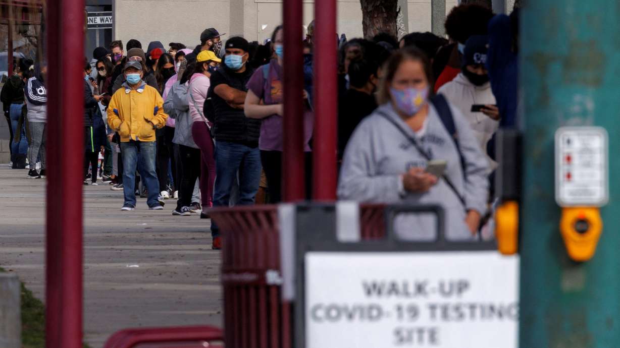 People wait outside a community center as long lines continue for individuals trying to be tested for COVID-19 during the outbreak of the coronavirus disease in San Diego, California, Jan. 10. President Joe Biden on Tuesday announced a national action plan to be developed by the U.S. health department to tackle the looming health crisis of long COVID.