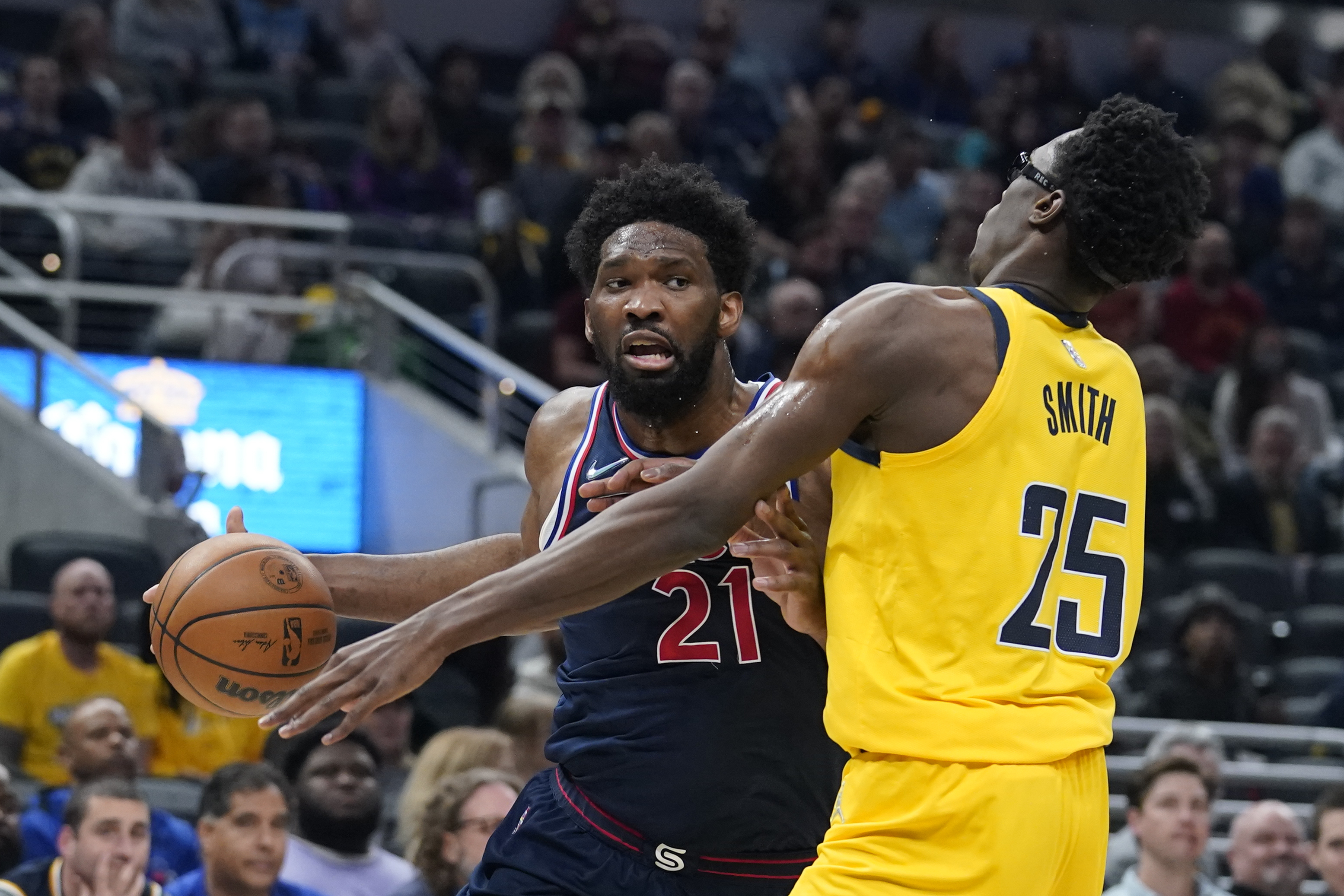 Philadelphia 76ers' Joel Embiid goes to the basket against Indiana Pacers' Jalen Smith during the first half of an NBA basketball game Tuesday, April 5, 2022, in Indianapolis. 