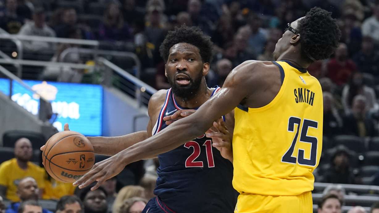 Philadelphia 76ers' Joel Embiid goes to the basket against Indiana Pacers' Jalen Smith during the first half of an NBA basketball game Tuesday, April 5, 2022, in Indianapolis.