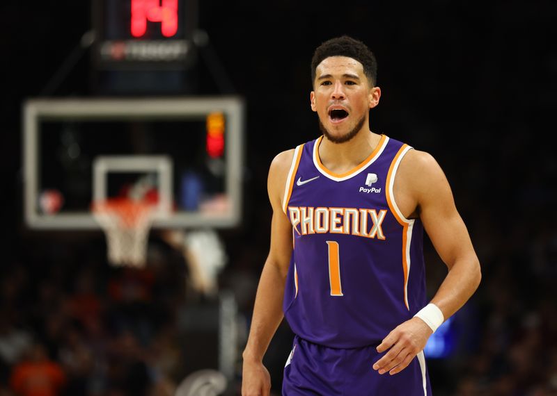 Apr 5, 2022; Phoenix, Arizona, USA; Phoenix Suns guard Devin Booker (1) reacts against the Los Angeles Lakers in the first half at Footprint Center.
