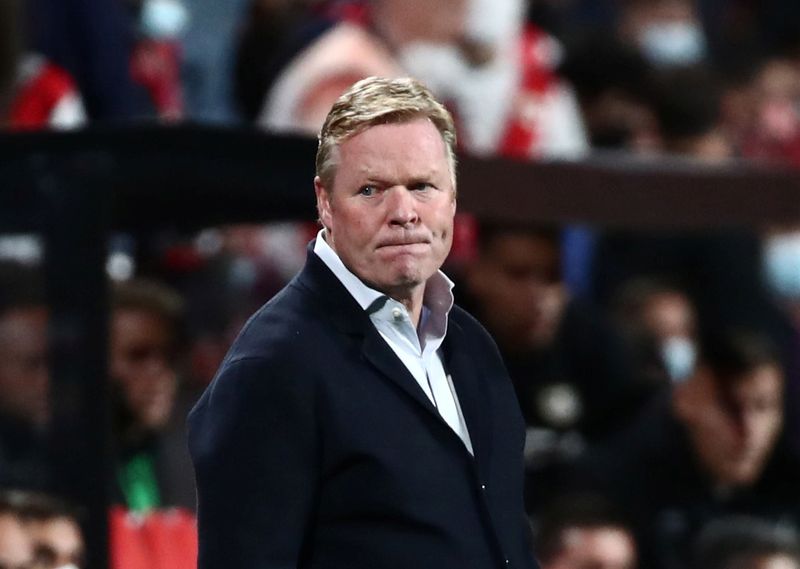 FILE PHOTO: Soccer Football - LaLiga - Rayo Vallecano v FC Barcelona - Estadio de Vallecas, Madrid, Spain - October 27, 2021  FC Barcelona coach Ronald Koeman looks on