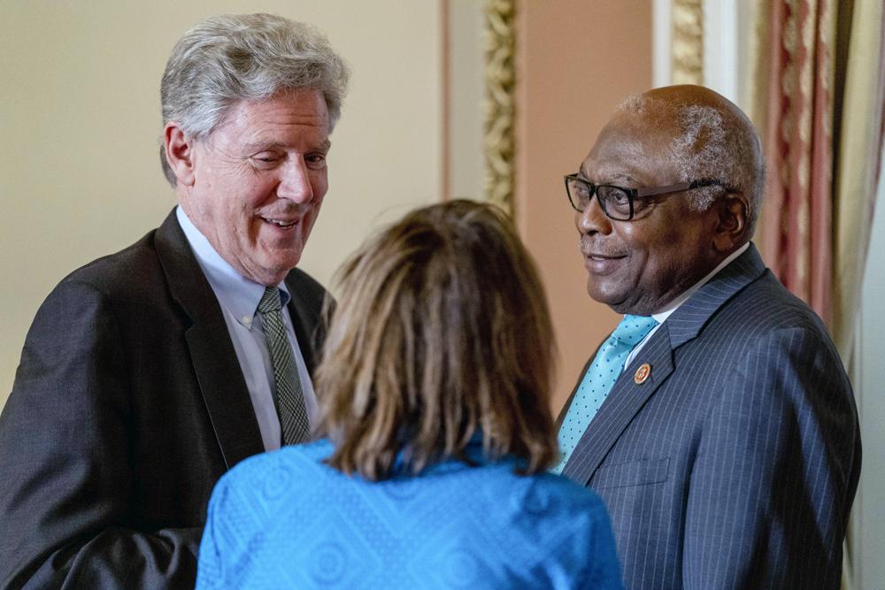 House Speaker Nancy Pelosi of Calif., center, speaks with House Majority Whip James Clyburn, of S.C., right, and Rep. Frank Pallone, D-N.J., left, after a bill-signing ceremony on Capitol Hill in Washington, March 17. House Democrats on Wednesday accused oil companies of “ripping off the American people."