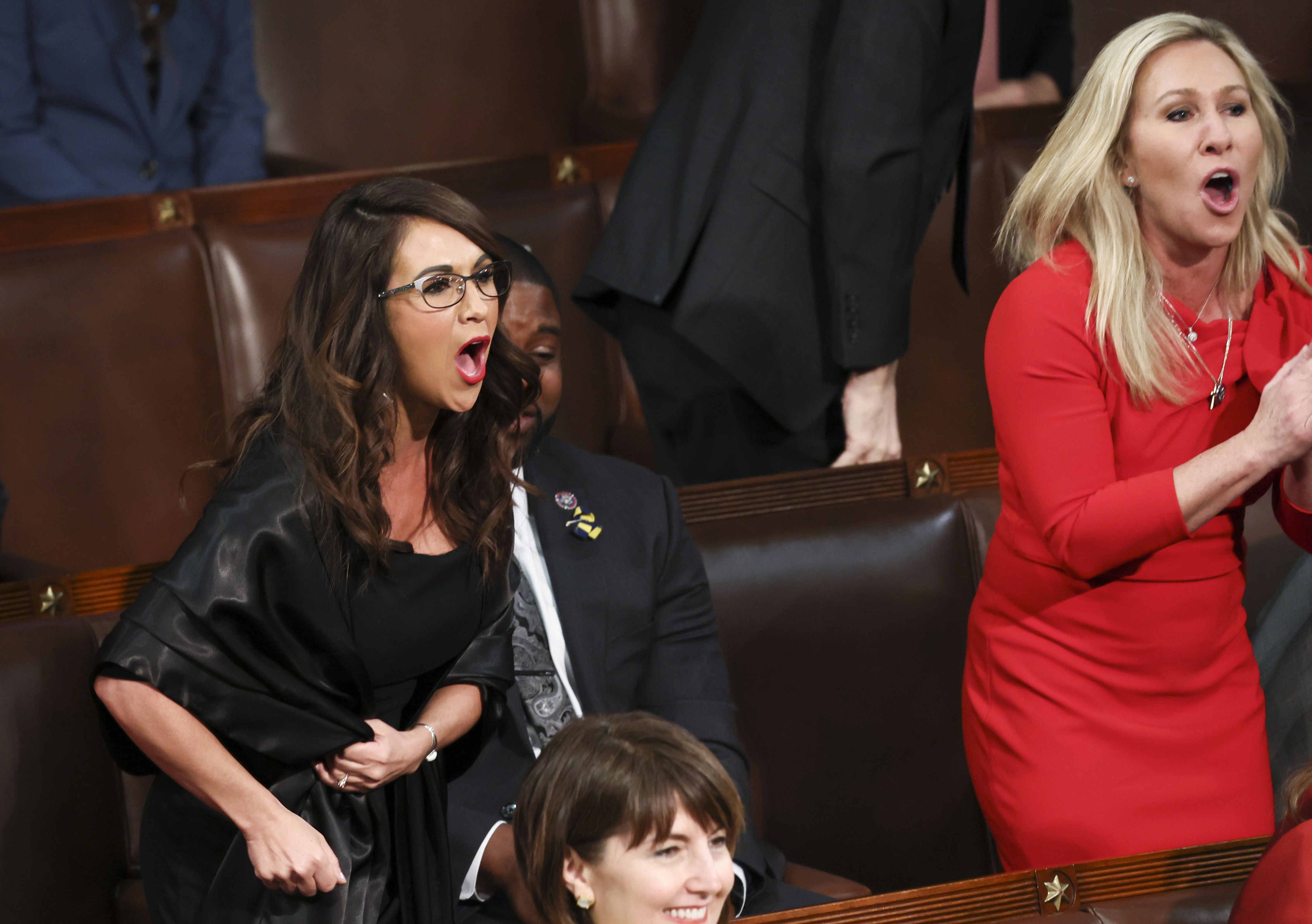 Rep. Lauren Boebert, R-Colo., left, and Rep. Marjorie Taylor Greene, R-Ga., right, scream “Build the Wall” as President Joe Biden delivers his first State of the Union address to a joint session of Congress at the Capitol, March 1, in Washington.