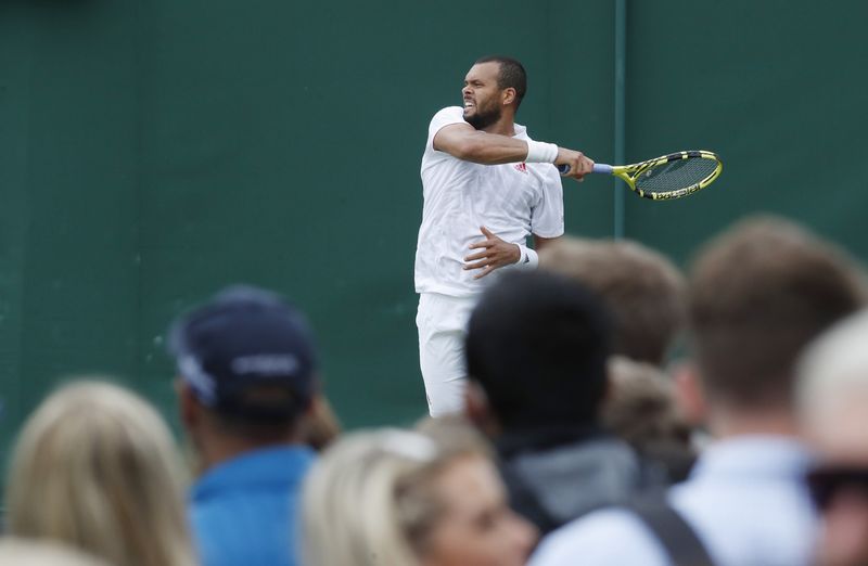 Tennis - Wimbledon - All England Lawn Tennis and Croquet Club, London, Britain - June 30, 2021 France's Jo-Wilfried Tsonga in action during his first round match against Sweden's Mikael Ymer