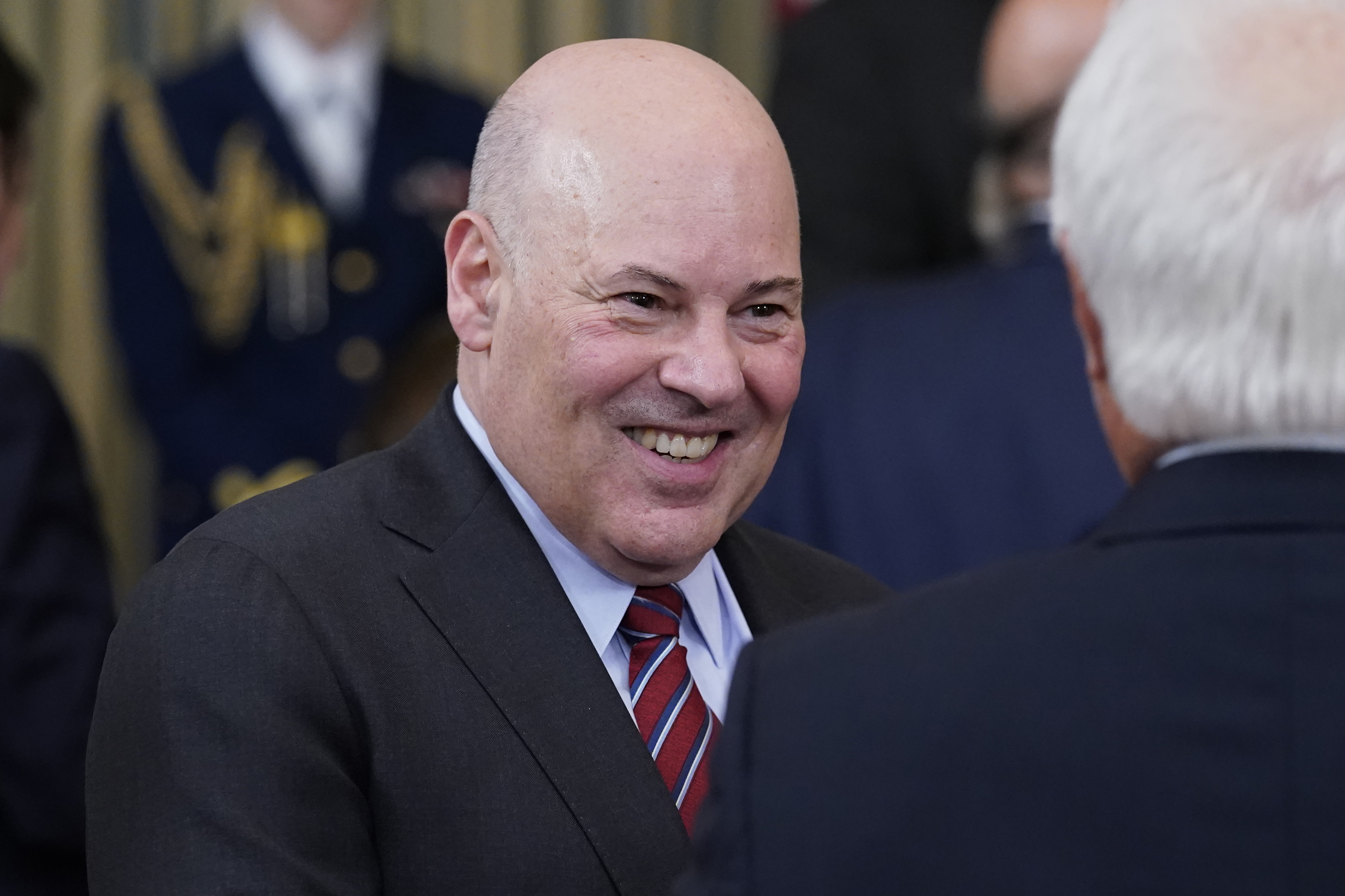 Postmaster General Louis Dejoy talks after President Joe Biden signed the Postal Service Reform Act of 2022 in the State Dining Room at the White House in Washington, Wednesday. The long-fought postal overhaul has been years in the making. It comes amid widespread complaints about mail service slowdowns.