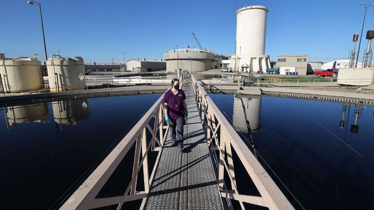 Maddi Crezee walks over the primary clarifier at Salt Lake City Water Reclamation Facility in Salt Lake City on Wednesday. The water at the facility is tested for COVID-19 twice a week.