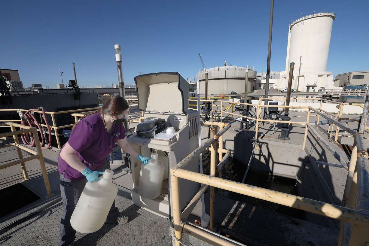 Maddi Crezee gets a sample of raw sewage at the Salt Lake City Water Reclamation Facility in Salt Lake City on Wednesday. The water at the facility is tested for COVID-19 twice a week.
