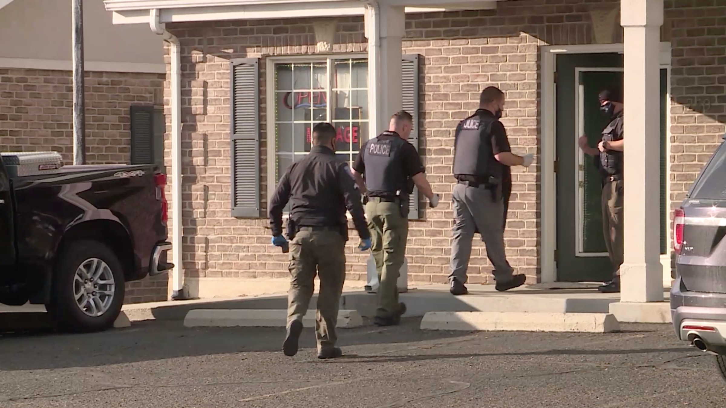 Police officers are seen at Small Rainbow in Orem on Feb. 4, 2021. At least six people were arrested following an investigation into several massage parlors in Utah County that police say were fronts for human trafficking and prostitution. Despite public perceptions that human trafficking is an “international problem,” it is occurring in urban and rural areas of Utah, according to a new report.