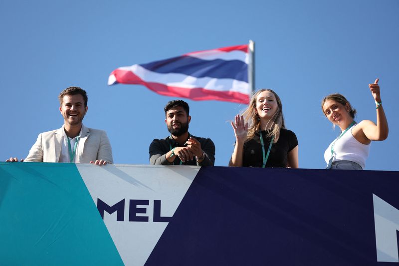 Formula One F1 - Australian Grand Prix - Melbourne Grand Prix Circuit, Melbourne, Australia - April 7, 2022 Fans wave ahead of the Australian Grand Prix