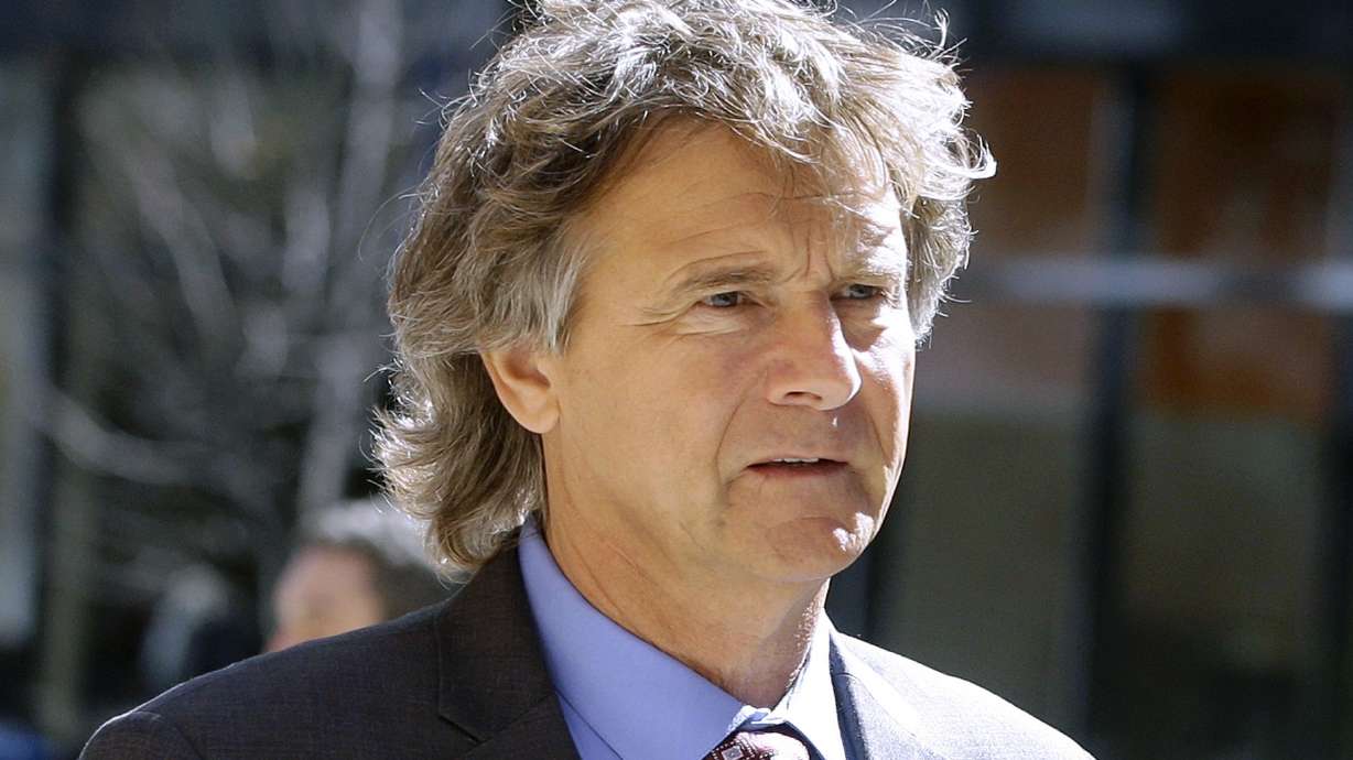 FILE - Jovan Vavic, a former University of Southern California water polo coach, arrives at federal court in Boston, March 25, 2019, to face charges in a nationwide college admissions bribery scandal. Opening arguments began, Thursday, March 10, 2022, in Boston federal court in Vavic's racketeering case, the only coach of the many implicated to take his case to trial.