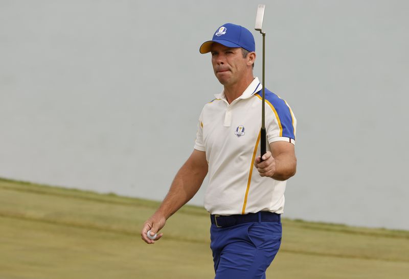 FILE PHOTO: Golf - The 2020 Ryder Cup - Whistling Straits, Sheboygan, Wisconsin, U.S. - September 26, 2021 Team Europe's Paul Casey reacts after holing his putt on the 3rd green during the Singles